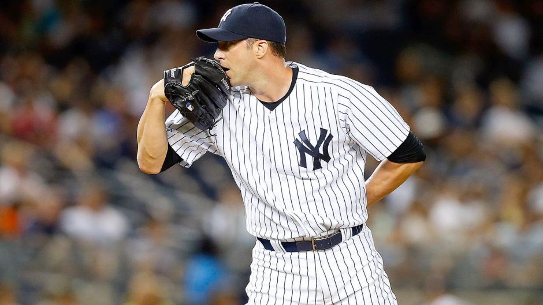 NEW YORK, NY - AUGUST 20: Chris Capuano #26 of the New York Yankees in action against the Cleveland Indians at Yankee Stadium on August 20, 2015 in the Bronx borough of New York City. The Indians defeated the Yankees 3-2. (Photo by Jim McIsaac/Getty Images)