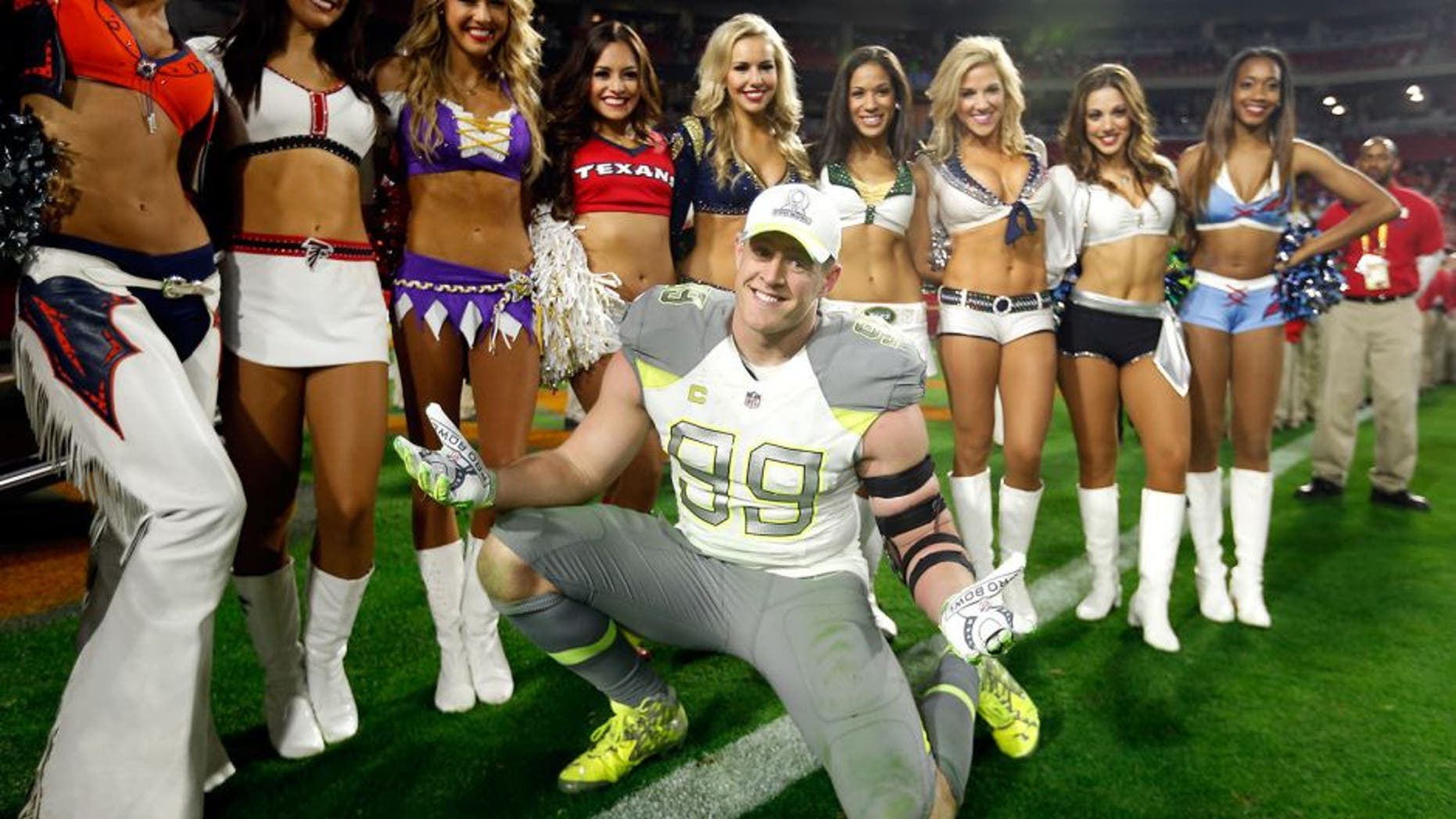 GLENDALE, AZ - JANUARY 25: Team Carter defensive end J.J. Watt #99 of the Houston Texans poses with cheerleaders after the 2015 Pro Bowl at University of Phoenix Stadium on January 25, 2015 in Glendale, Arizona. (Photo by Christian Petersen/Getty Images)