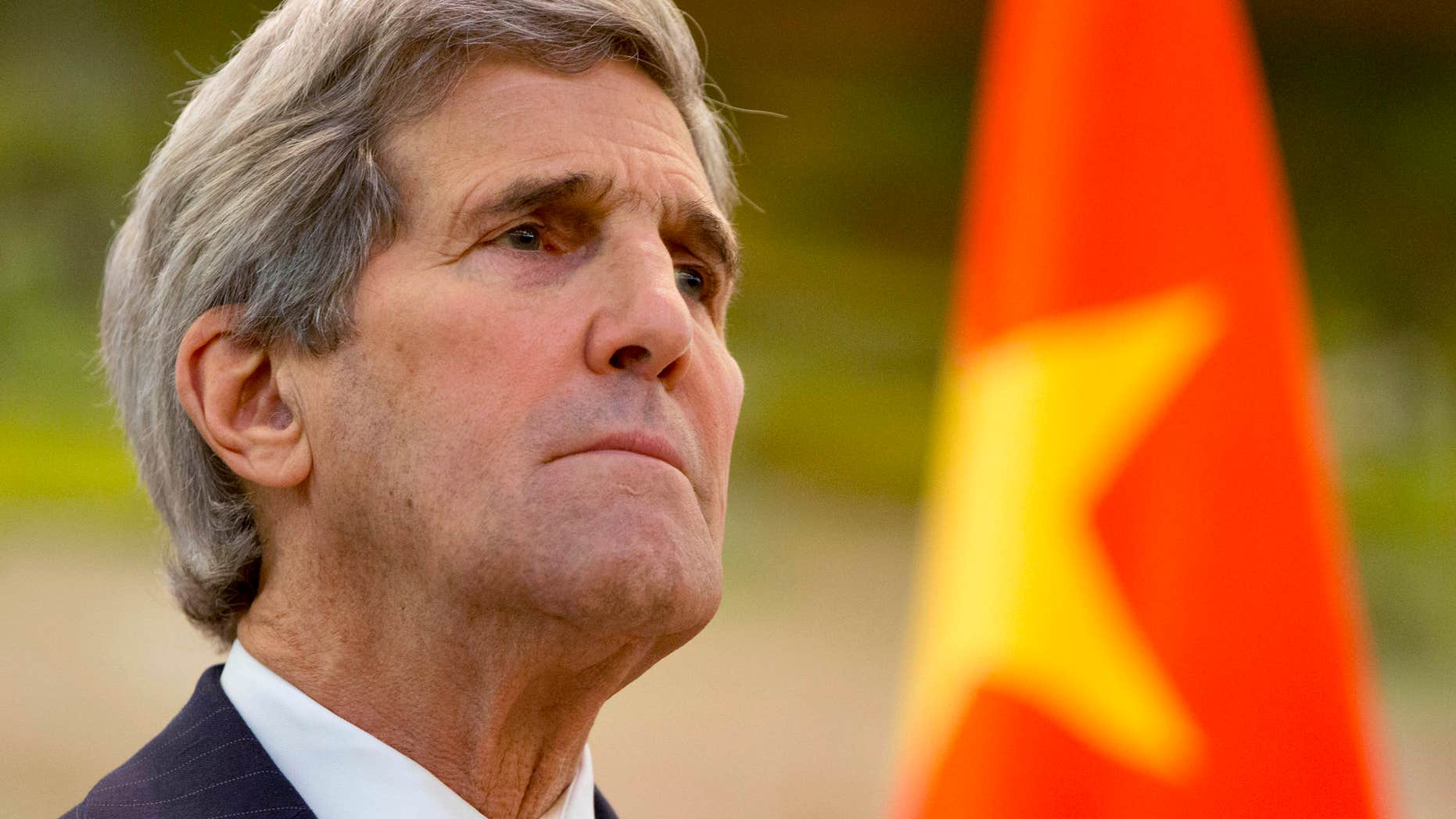 Jan. 27, 2016: U.S. Secretary of State John Kerry listens to an opening statement by Chinese Foreign Minister Wang Yi during a news conference at the Ministry of Foreign Affairs in Beijing on the final leg in Kerry's latest round-the-world diplomatic mission.