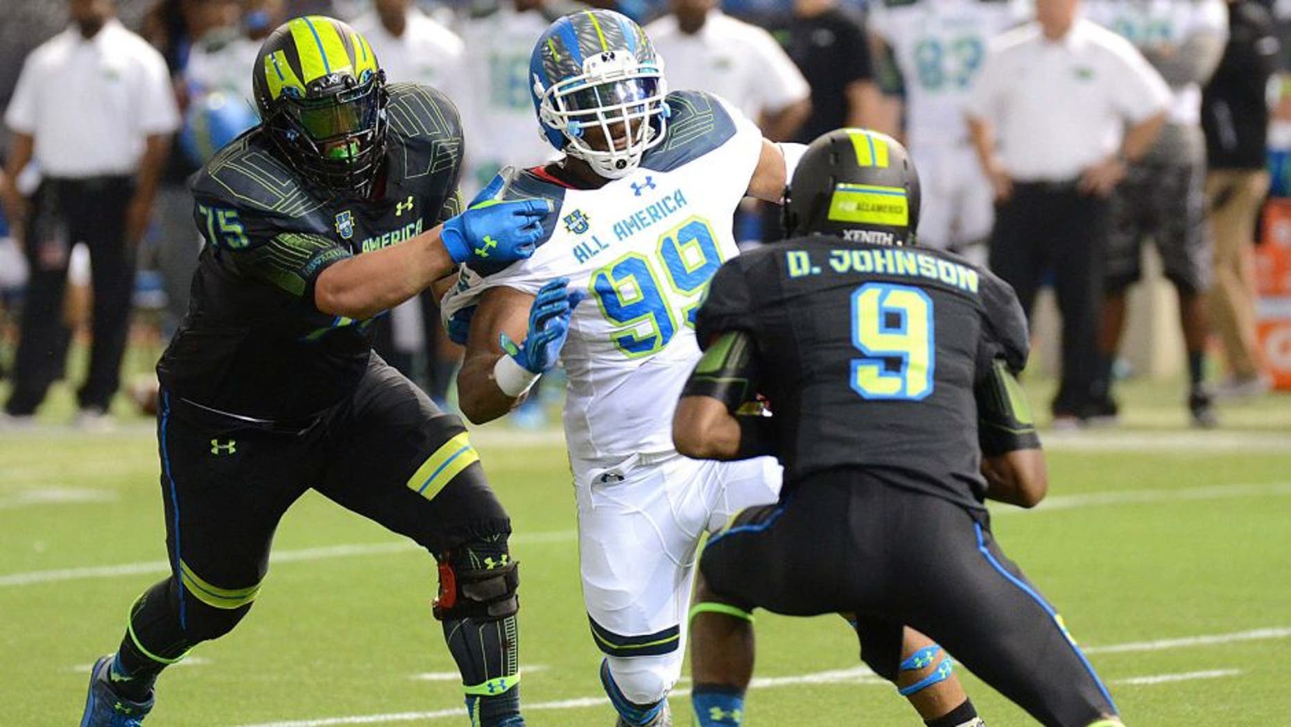 Jan 2, 2015; St. Petersburg, FL, USA; Team Highlight defensive end Byron Cowart (99) rushes Team Armour quarterback DeâAndre Johnson (9) during the first half of the 2015 Under Armour All-America Game at Tropicana Field. Team Highlight defeated Team Armour 46-6. Mandatory Credit: Jonathan Dyer-USA TODAY Sports