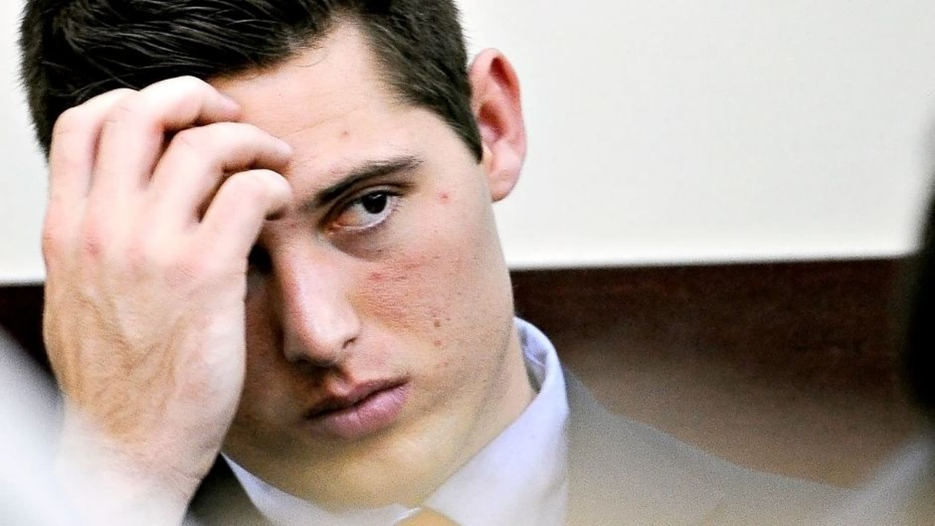 Brandon Vandenburg looks at the jury as Judge Wilkins reads the charges during his trial on Tuesday, Jan. 27, 2015 in Nashville, Tenn. Vandenburg and Cory Batey, two former Vanderbilt football players, are each charged with five counts of aggravated rape and two counts of aggravated sexual battery. (AP Photo/The Tennessean, John Partipilo, Pool)