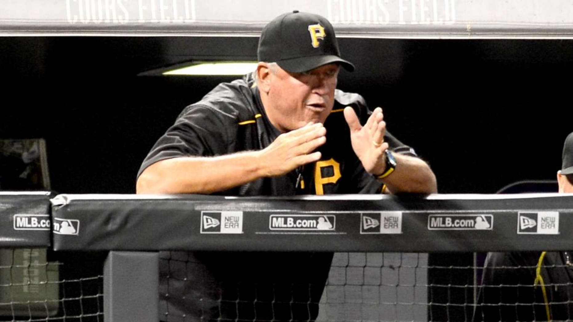 Sep 21, 2015; Denver, CO, USA; Pittsburgh Pirates manager Clint Hurdle (13) calls out from the dugout in the fifth inning against the Colorado Rockies at Coors Field. Mandatory Credit: Ron Chenoy-USA TODAY Sports