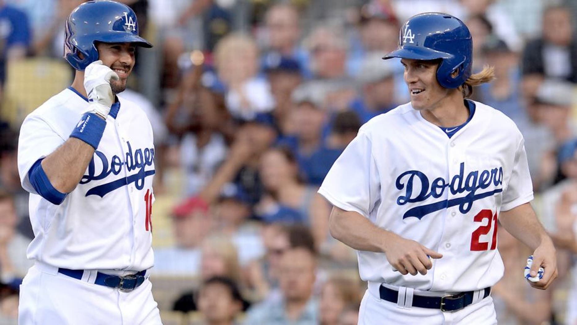 Jun 7, 2015; Los Angeles, CA, USA; Los Angeles Dodgers starting pitcher Zack Greinke (21) is met by right fielder Andre Ethier (16) after he crossed the plate for a run off a single by third baseman Justin Turner (10) in the third inning of the game against the St. Louis Cardinals at Dodger Stadium. Mandatory Credit: Jayne Kamin-Oncea-USA TODAY Sports