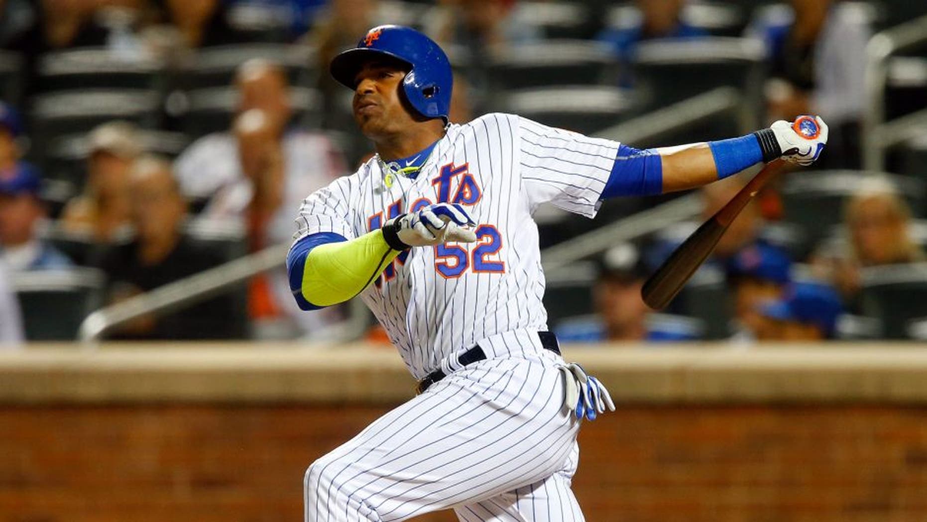 NEW YORK, NY - SEPTEMBER 14: Yoenis Cespedes #52 of the New York Mets hits a third-inning home run against the Miami Marlins at Citi Field on September 14, 2015 in the Flushing neighborhood of the Queens borough of New York City. (Photo by Jim McIsaac/Getty Images)