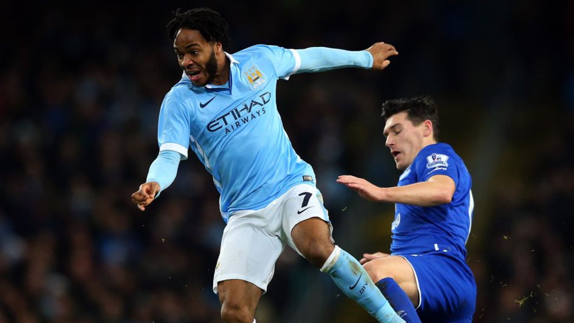 MANCHESTER, ENGLAND - JANUARY 27: Raheem Sterling of Manchester City is tackled by Gareth Barry of Everton during the Capital One Cup Semi Final, second leg match between Manchester City and Everton at the Etihad Stadium on January 27, 2016 in Manchester, England. (Photo by Alex Livesey/Getty Images)