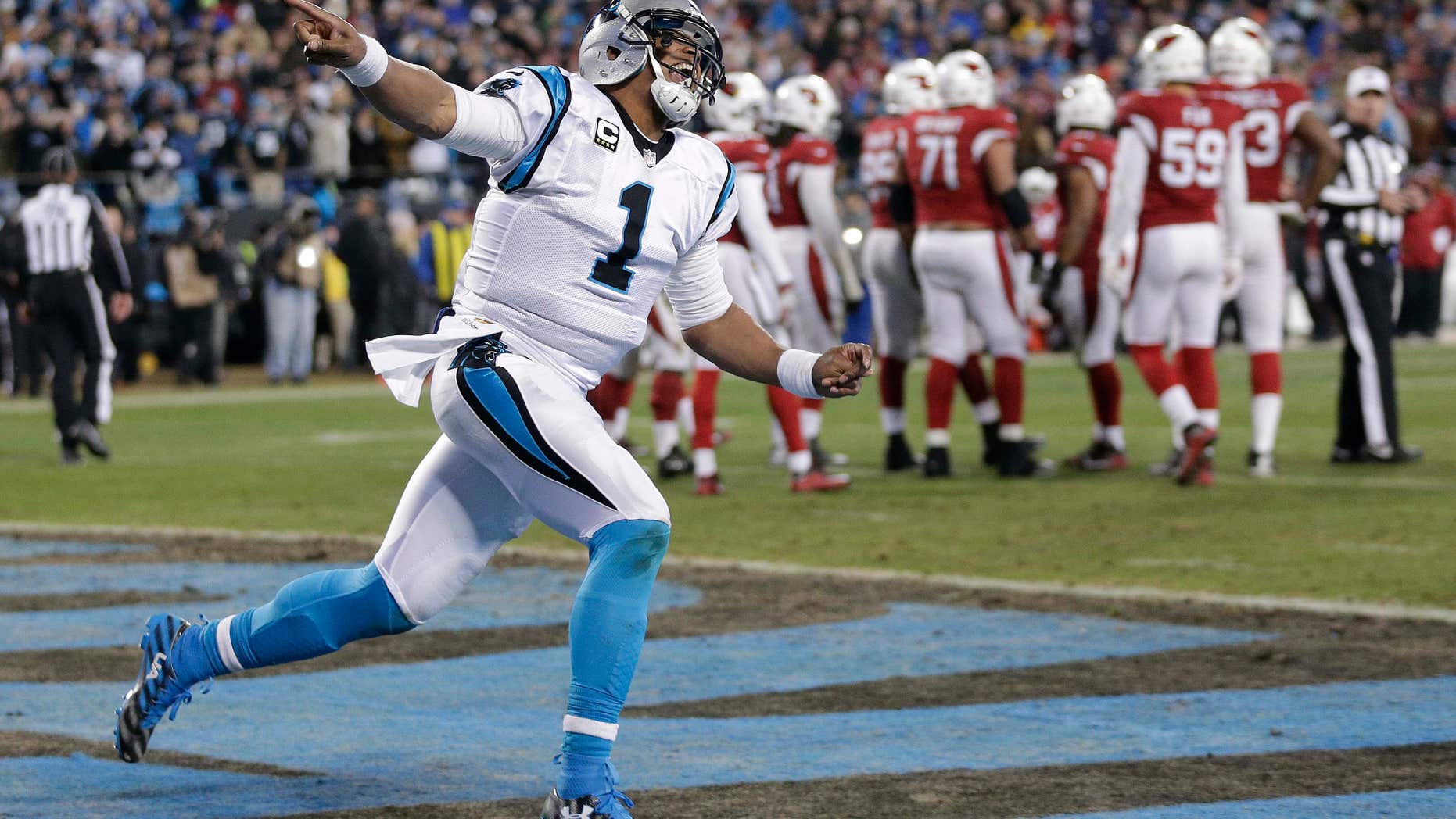 File - In this Jan. 24, 2016, file photo, Carolina Panthers' Cam Newton celebrates his touchdown run during the first half the NFL football NFC Championship game against the Arizona Cardinals, in Charlotte, N.C.