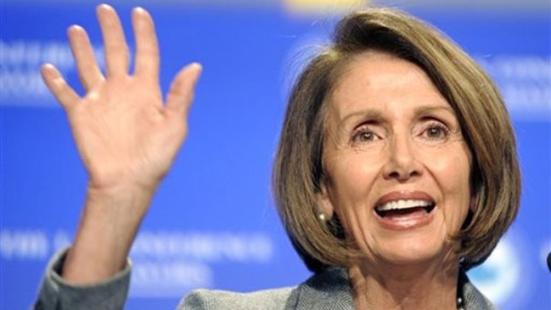 Jan. 20: House Speaker Nancy Pelosi of Calif. gestures while addressing the U.S. Conference of Mayors winter meeting in Washington (AP).