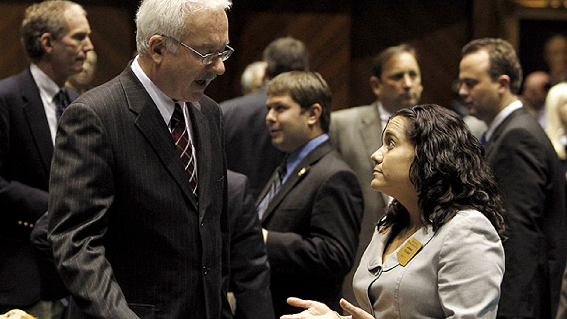 Jan. 27: After filing his bill challenging the U.S. Constitution's 14th Amendment, Rep. John Kavanagh, left, speaks with bill opponent Rep. Anna Tovar at the Arizona Capitol.