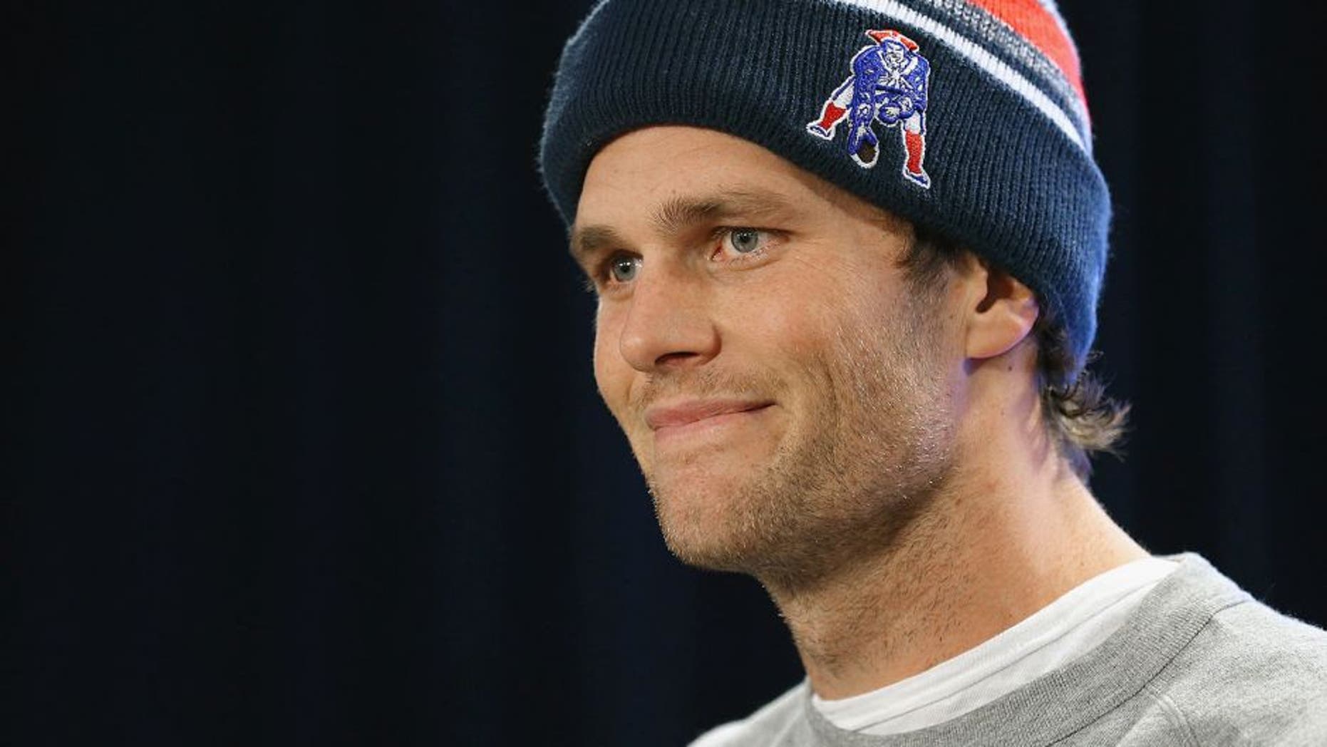 FOXBORO, MA - JANUARY 22: New England Patriots quarterback Tom Brady talks to the media during a press conference to address the under inflation of footballs used in the AFC championship game at Gillette Stadium on January 22, 2015 in Foxboro, Massachusetts. (Photo by Maddie Meyer/Getty Images)