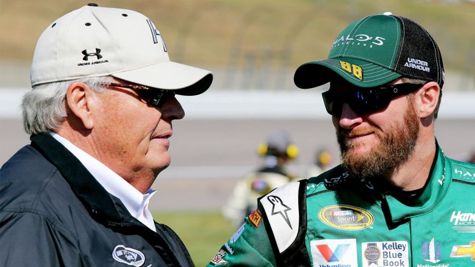 KANSAS CITY, KS - OCTOBER 18: Dale Earnhardt Jr., driver of the #88 Halo 5: Master Chief Chevrolet, talks with Rick Hendrick, owner of Hendrick Motorsports, on the grid prior to the NASCAR Sprint Cup Series Hollywood Casino 400 at Kansas Speedway on October 18, 2015 in Kansas City, Kansas. (Photo by Jerry Markland/Getty Images)