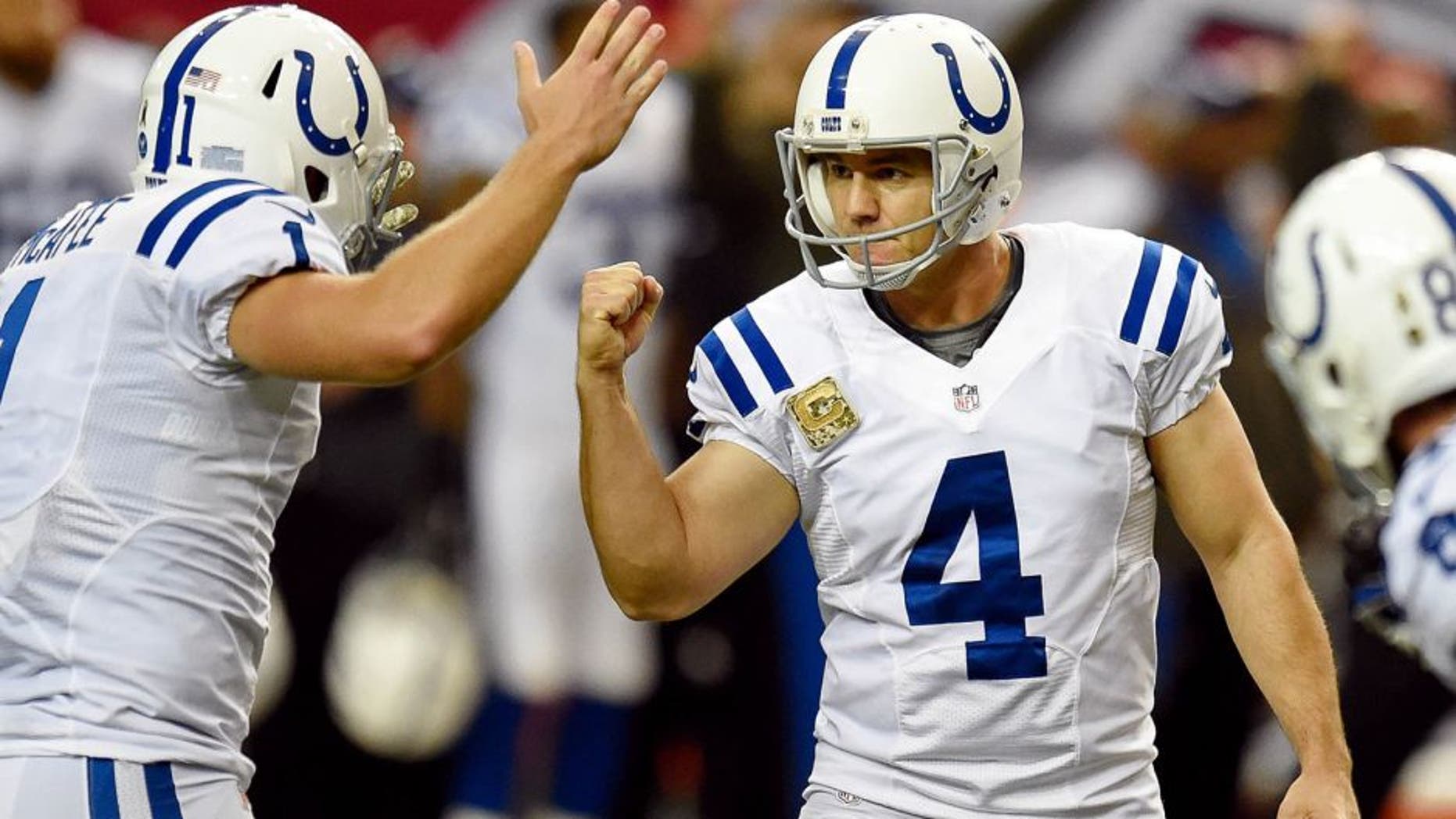 Nov 22, 2015; Atlanta, GA, USA; Indianapolis Colts place kicker Adam Vinatieri (4) reacts with punter Pat McAfee (1) after kicking the go ahead field goal against the Atlanta Falcons during the fourth quarter at the Georgia Dome. The Colts defeated the Falcons 24-21. Mandatory Credit: Dale Zanine-USA TODAY Sports