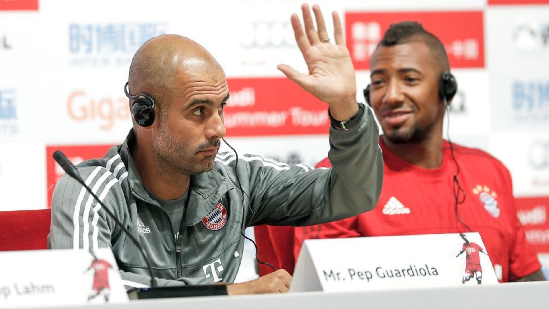 BEIJING, CHINA - JULY 17: Head coach Pep Guardiola of Bayern gestures with Jerome Boateng during the a press conference at National Stadium in day 1 of the FC Bayern Audi China Summer Pre-Season Tour on July 17, 2015 in Beijing, China. (Photo by Lintao Zhang/Getty Images)