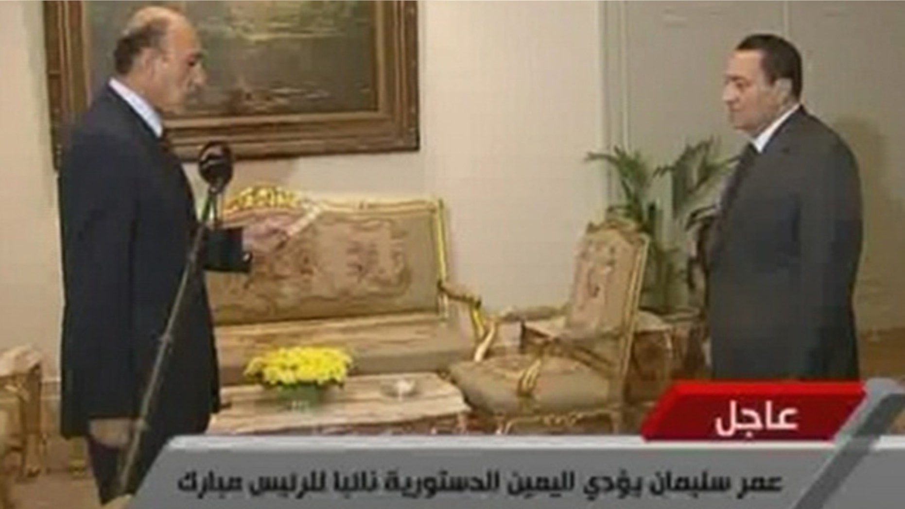 Jan. 29: In this image taken from TV, Egyptian President Hosni Mubarak, right, listens as Omar Suleiman swears the oath as Vice President of Egypt.