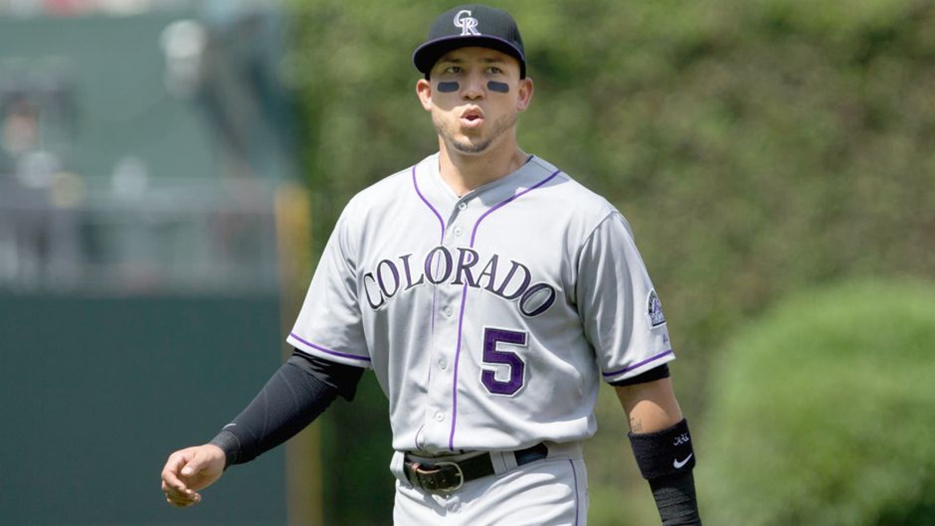 May 30, 2015; Philadelphia, PA, USA; Colorado Rockies right fielder Carlos Gonzalez (5) warms up before the first inning against the Philadelphia Phillies at Citizens Bank Park. Mandatory Credit: Bill Streicher-USA TODAY Sports