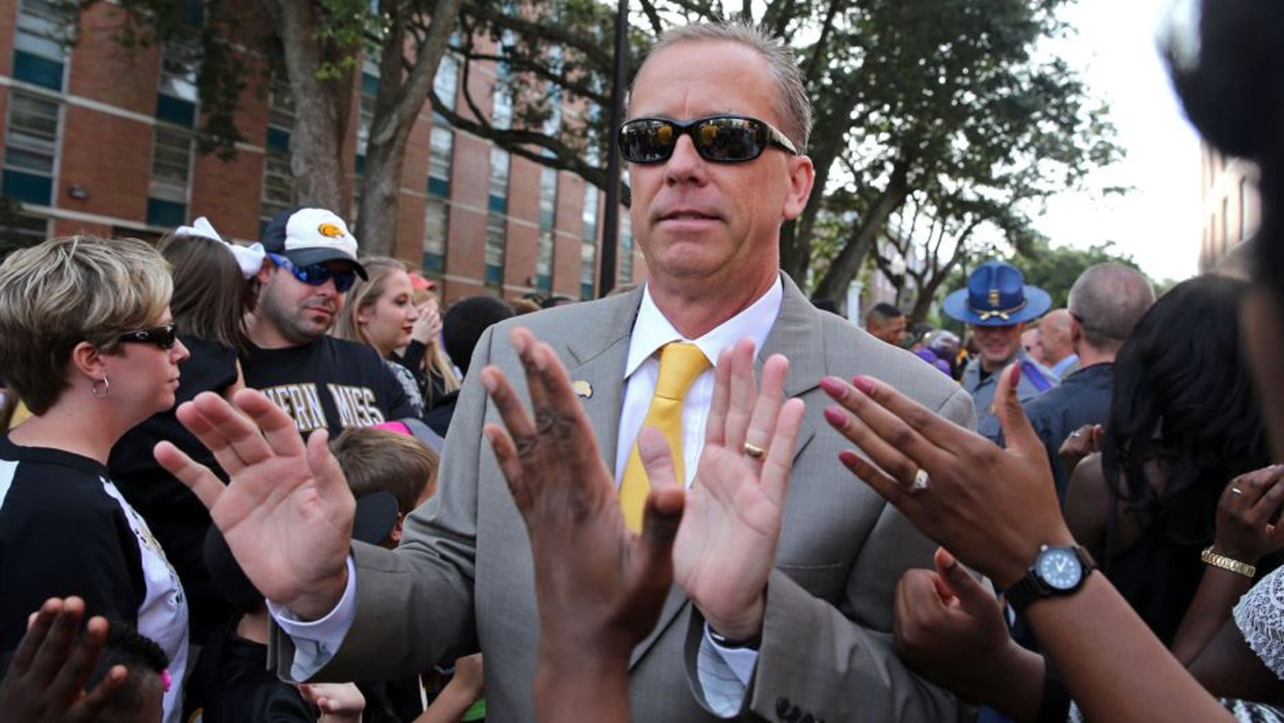 Oct 17, 2015; Hattiesburg, MS, USA; Southern Miss Golden Eagles head coach Todd Monken greets fans during Eagle Walk before their game against the UTSA Roadrunners at M.M. Roberts Stadium. Mandatory Credit: Chuck Cook-USA TODAY Sports
