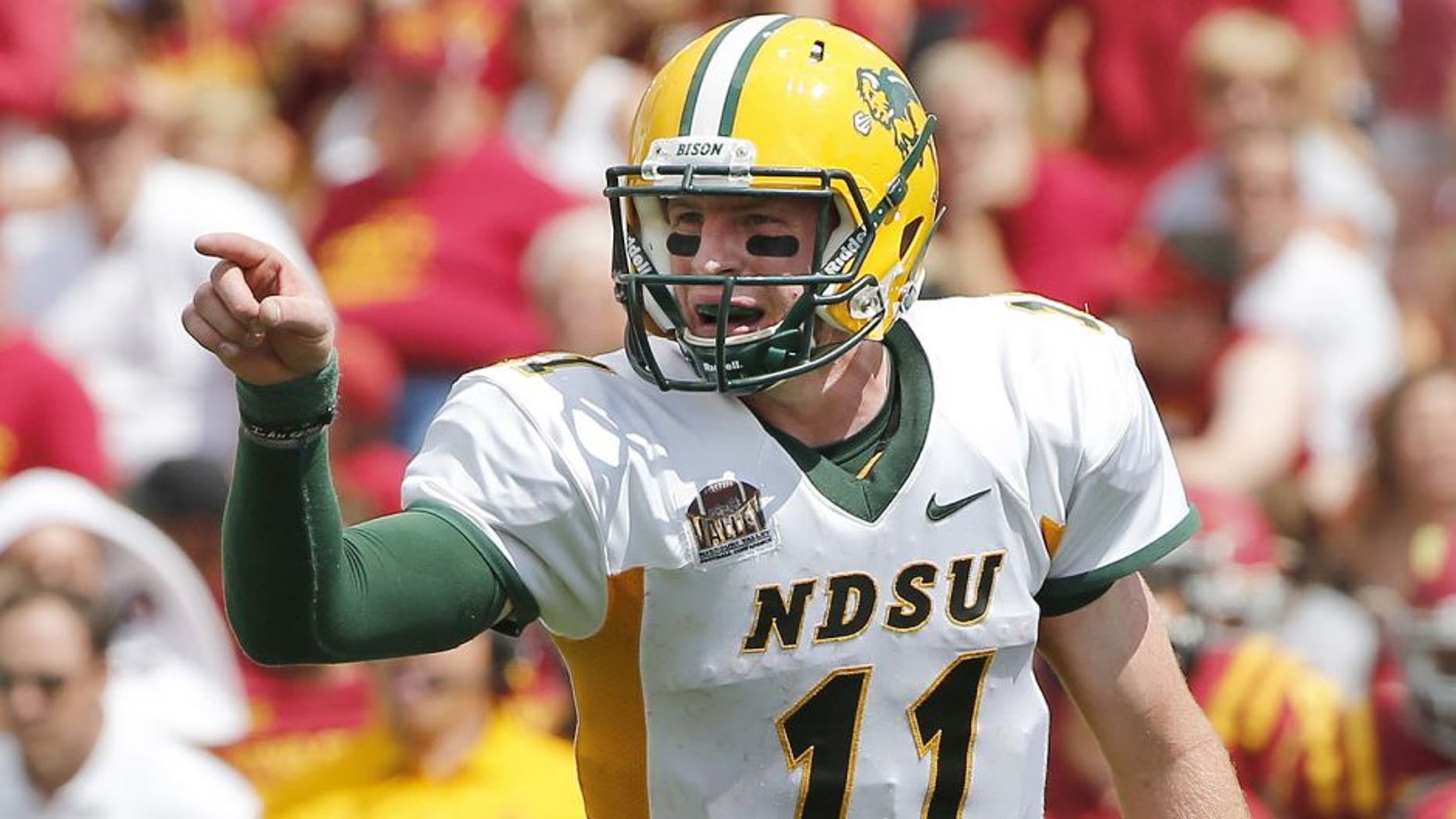 AMES, IA - AUGUST 30: Quarterback Carson Wentz #11 of the North Dakota State Bison calls a play in the second half of play against the Iowa State Cyclones at Jack Trice Stadium on August 30, 2014 in Ames, Iowa. North Dakota State defeated Iowa State 34-14. (Photo by David K Purdy/Getty Images)
