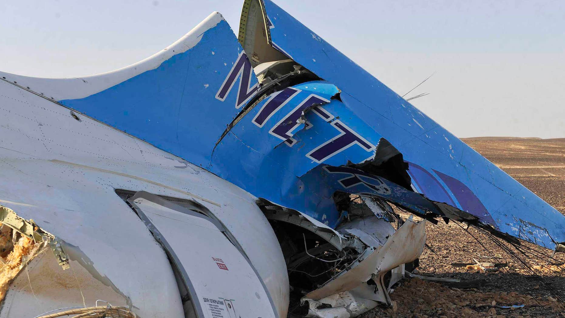Oct. 31, 2015: This photo released by the Prime Minister's office shows the tail of a Metrojet plane that crashed in Hassana, Egypt.