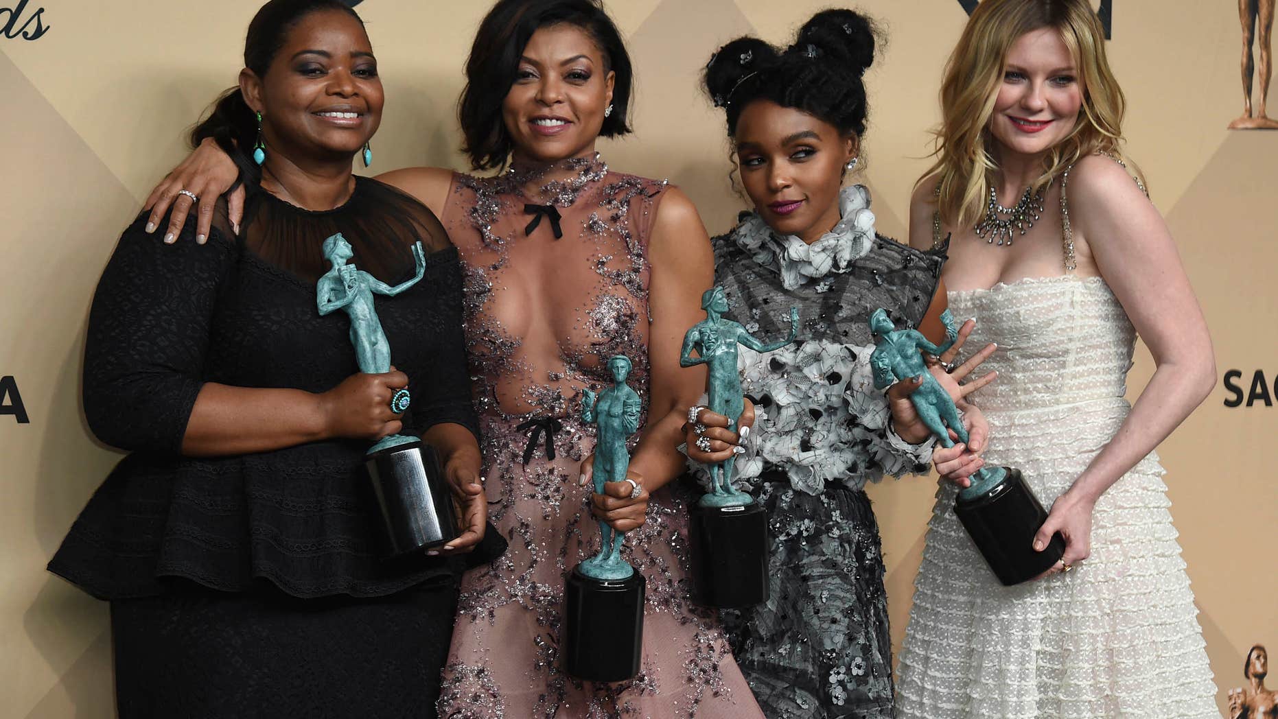 Octavia Spencer, from left, Taraji P. Henson, Janelle Monae, and Kirsten Dunst pose in the press room with the award for outstanding performance by a cast in a motion picture for "Hidden Figures" at the 23rd annual Screen Actors Guild Awards at the Shrine Auditorium & Expo Hall on Sunday, Jan. 29, 2017, in Los Angeles.