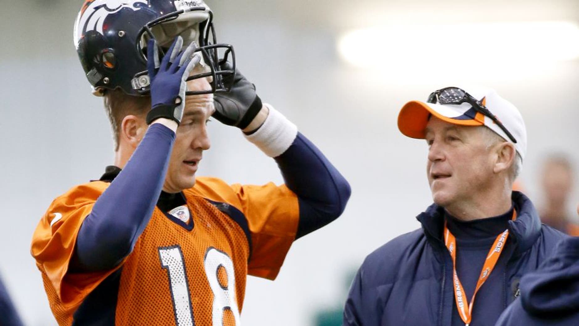 Denver Broncos quarterback Peyton Manning (18) talks with head coach John Fox during practice Thursday, Jan. 30, 2014, in Florham Park, N.J. The Broncos are scheduled to play the Seattle Seahawks in the NFL Super Bowl XLVIII football game Sunday, Feb. 2, in East Rutherford, N.J. (AP Photo)