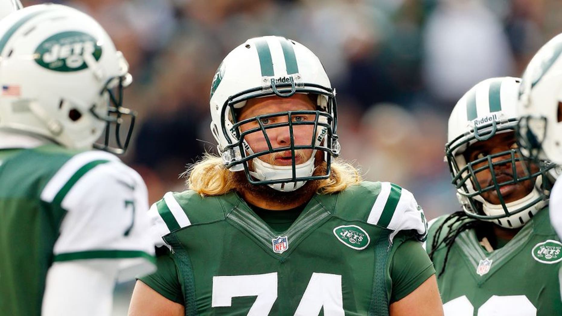 EAST RUTHERFORD, NJ - DECEMBER 01: (NEW YORK DAILIES OUT) Nick Mangold #74 of the New York Jets looks on against the Miami Dolphins on December 1, 2013 at MetLife Stadium in East Rutherford, New Jersey. The Dolphins defeated the Jets 23-3. (Photo by Jim McIsaac/Getty Images) *** Local Caption *** Nick Mangold