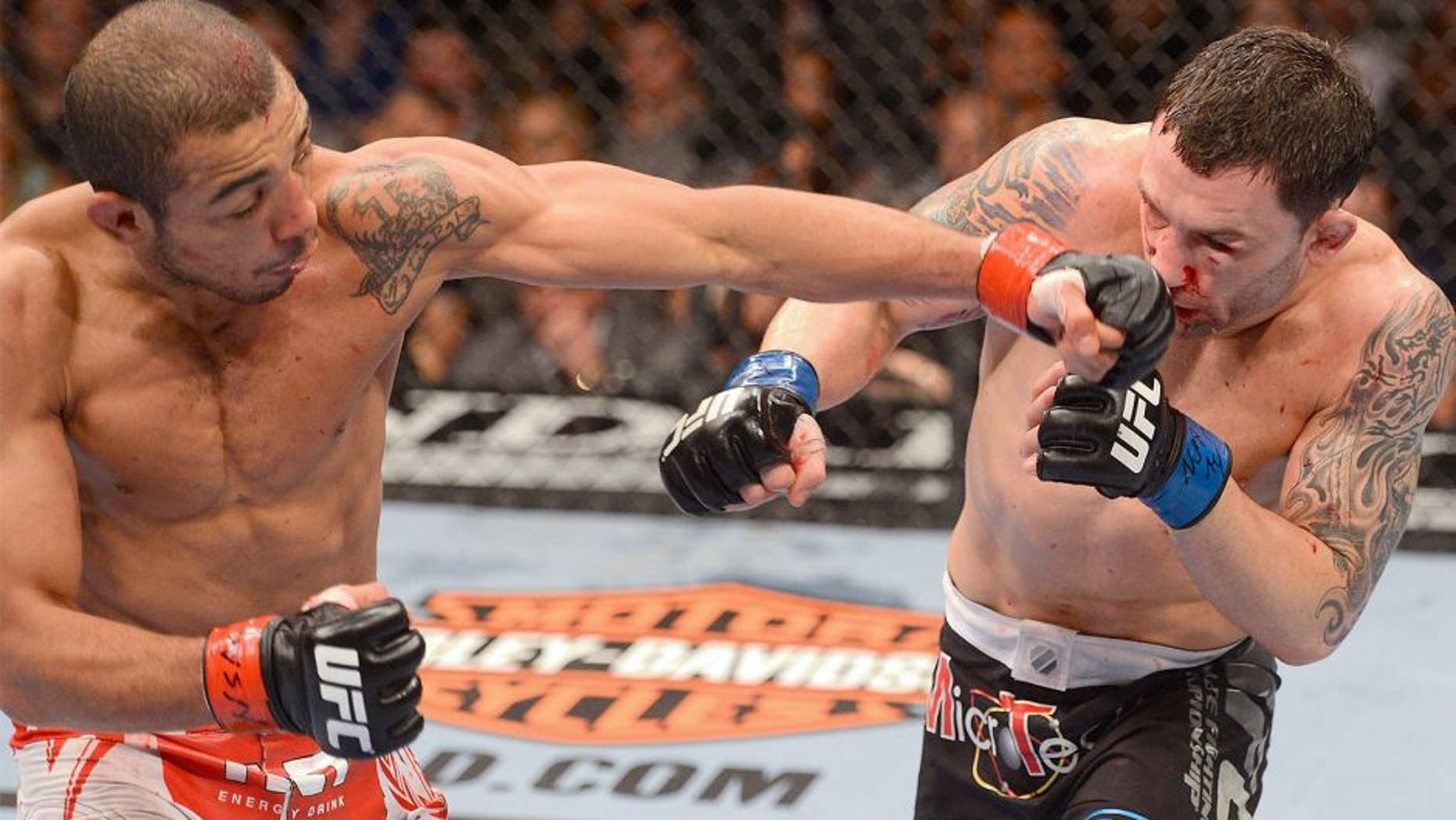 LAS VEGAS, NV - FEBRUARY 02: (L-R) Jose Aldo punches Frankie Edgar during their featherweight title fight at UFC 156 on February 2, 2013 at the Mandalay Bay Events Center in Las Vegas, Nevada. (Photo by Donald Miralle/Zuffa LLC/Zuffa LLC via Getty Images)