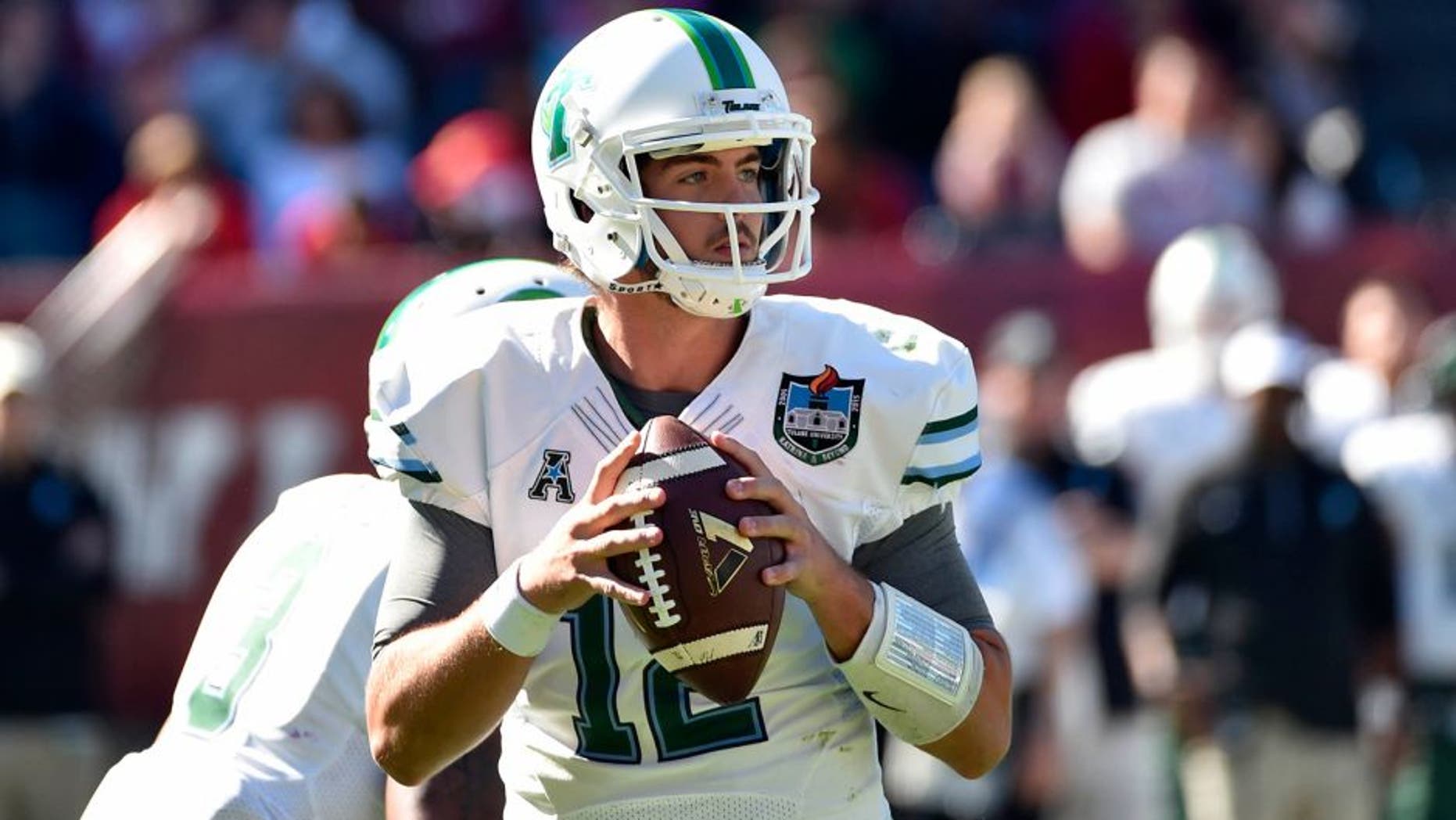 Oct 10, 2015; Philadelphia, PA, USA; Tulane Green Wave quarterback Tanner Lee (12) looks to throw against the Temple Owls at Lincoln Financial Field. The Temple Owls won 49-10. Mandatory Credit: Derik Hamilton-USA TODAY Sports