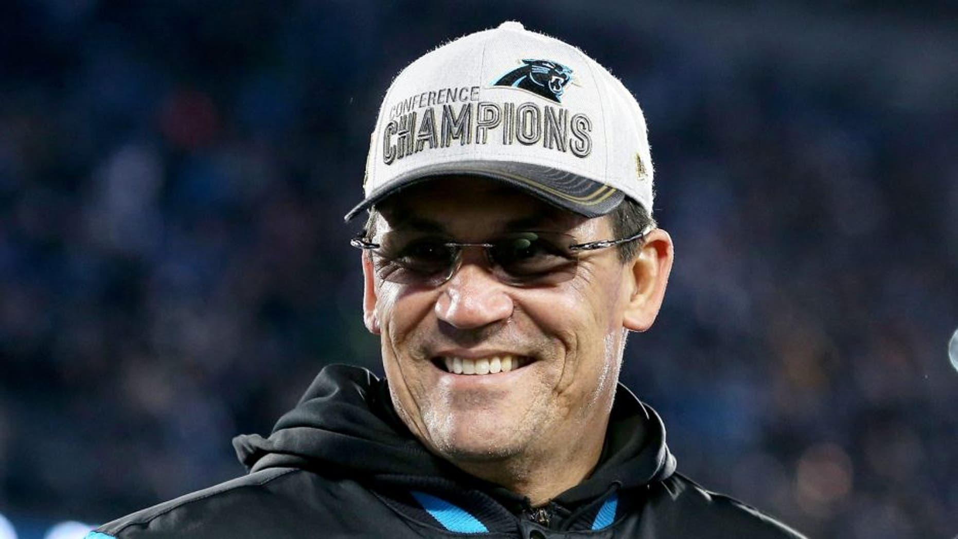 CHARLOTTE, NC - JANUARY 24: (L-R) Head coach Ron Rivera and owner Jerry Richardson of the Carolina Panthers smile after defeating the Arizona Cardinals with a score of 49 to 15 in the NFC Championship Game at Bank of America Stadium on January 24, 2016 in Charlotte, North Carolina. (Photo by Streeter Lecka/Getty Images)
