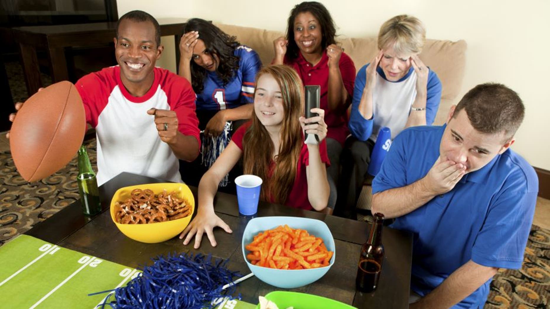 Diverse Group of Family and Friends Watching a Football Game
