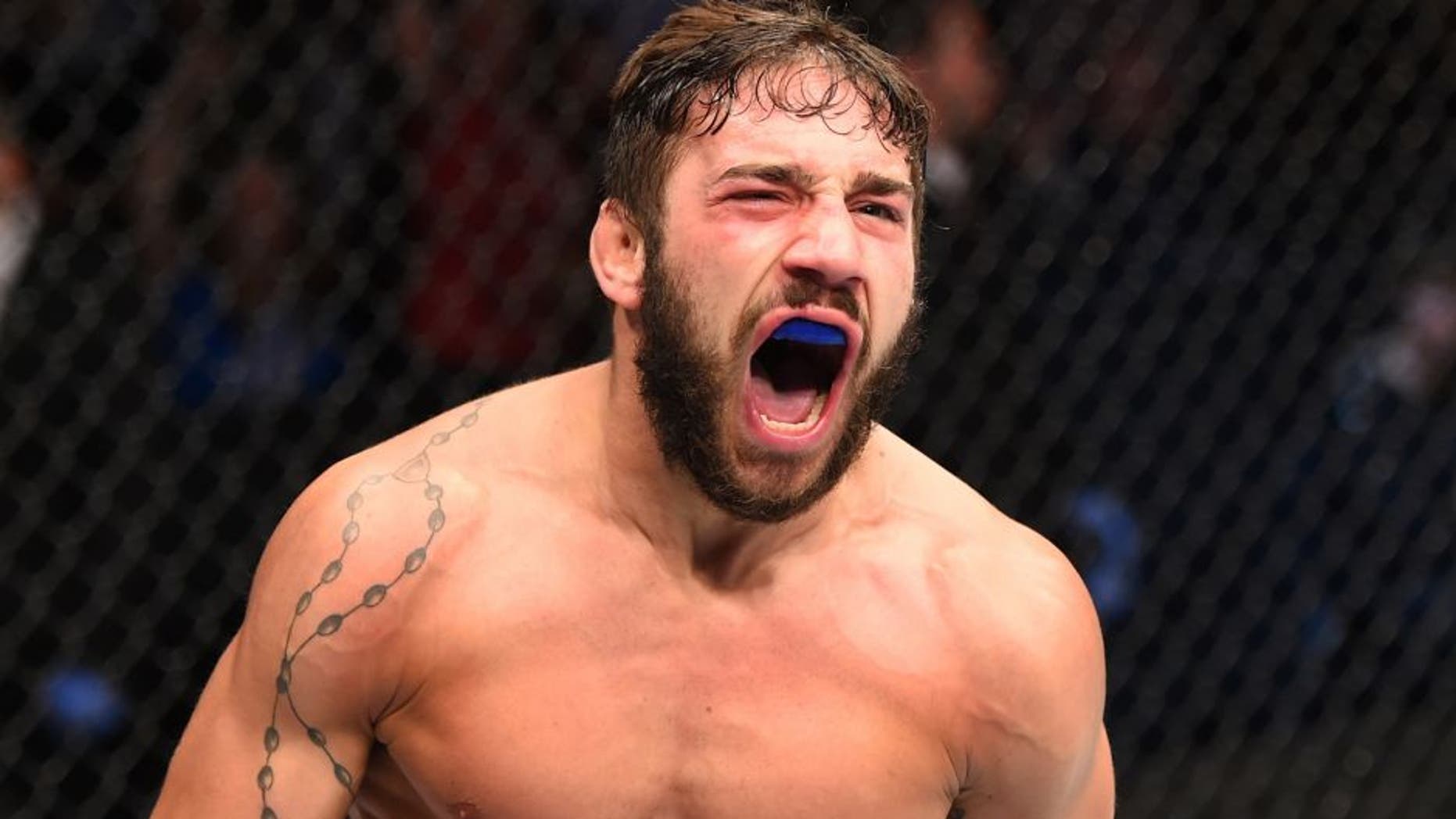 GLASGOW, SCOTLAND - JULY 18: Jimmie Rivera of the United States reacts after his TKO victory over Marcus Brimage of the United States in their bantamweight fight during the UFC Fight Night event inside the SSE Hydro on July 18, 2015 in Glasgow, Scotland. (Photo by Josh Hedges/Zuffa LLC/Zuffa LLC via Getty Images)
