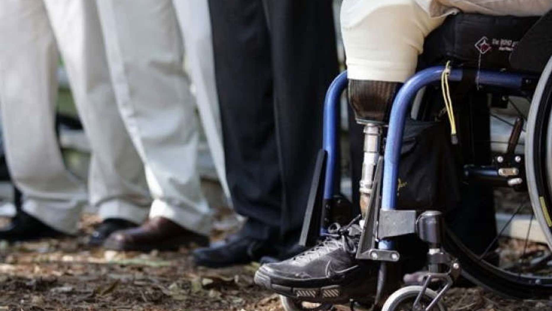 Wounded Iraq war veteran Joe Beimfohr sits among injured war veterans during a news conference held by the Wounded Warrior Project to urge Congress to pass a final version of the Dignified Treatment of Wounded Warriors Act.