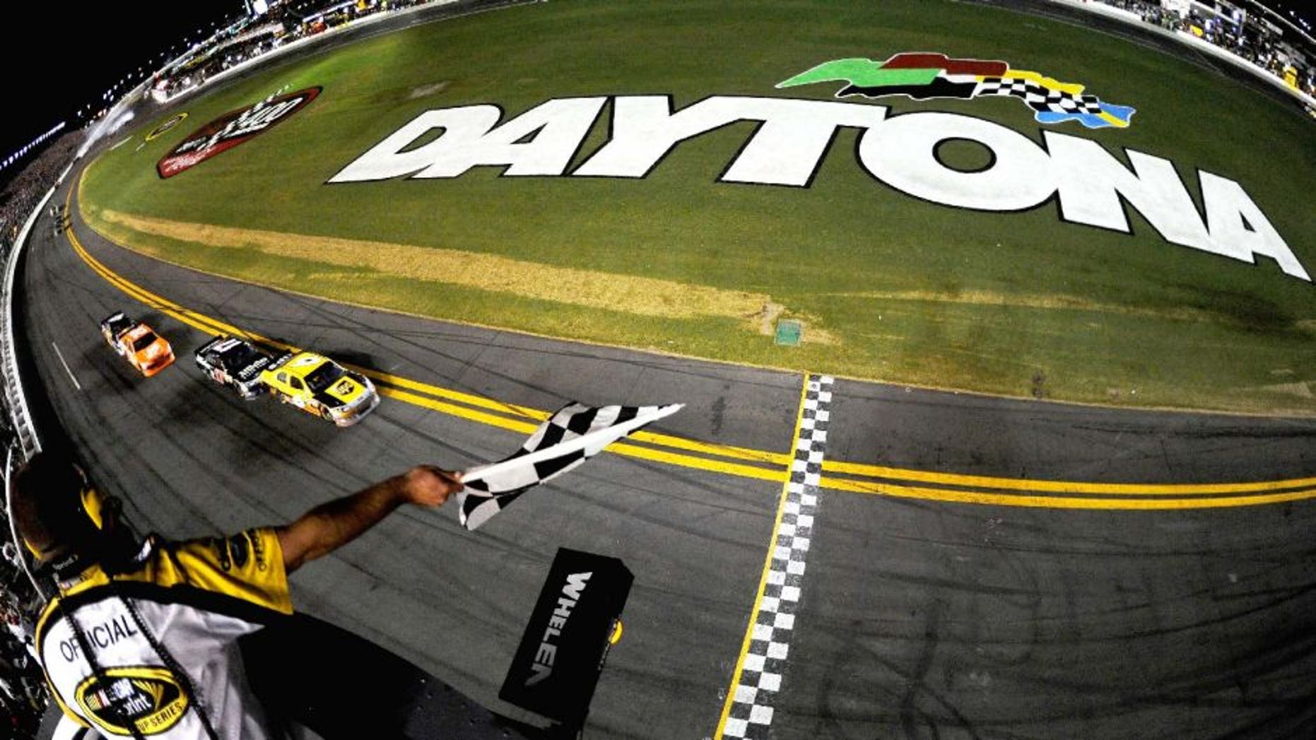 DAYTONA BEACH, FL - JULY 02: David Ragan, driver of the #6 UPS Ford, heads towards the start/finsish line ahead of teammate Matt Kenseth, driver of the #17 Affliction Clothing: Live Fast Ford, to take the checkered flag and win the NASCAR Sprint Cup Series Coke ZERO 400 Powered by Coca-Cola at Daytona International Speedway on July 2, 2011 in Daytona Beach, Florida. (Photo by Mike Ehrmann/Getty Images for NASCAR)