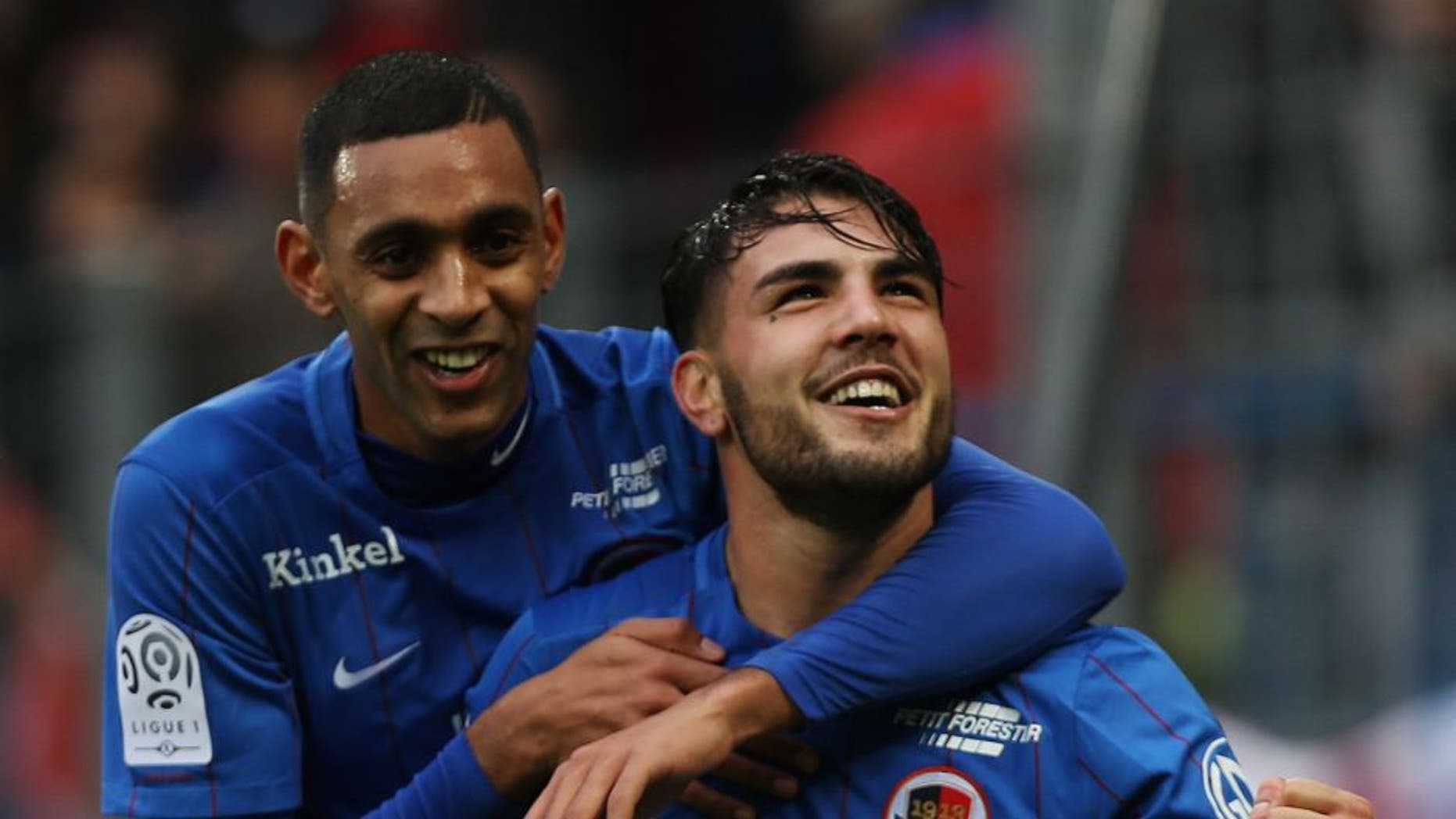 Caen's French forward Andy Delort (R) is congratulated by Caen's French forward Ronny Rodelin after scoring a penalty kick during the French L1 football match between Caen (SM Caen) and Nice (OGC Nice) on January 31, 2016 at the Michel d'Ornano stadium in Caen. AFP PHOTO / CHARLY TRIBALLEAU / AFP / CHARLY TRIBALLEAU (Photo credit should read CHARLY TRIBALLEAU/AFP/Getty Images)