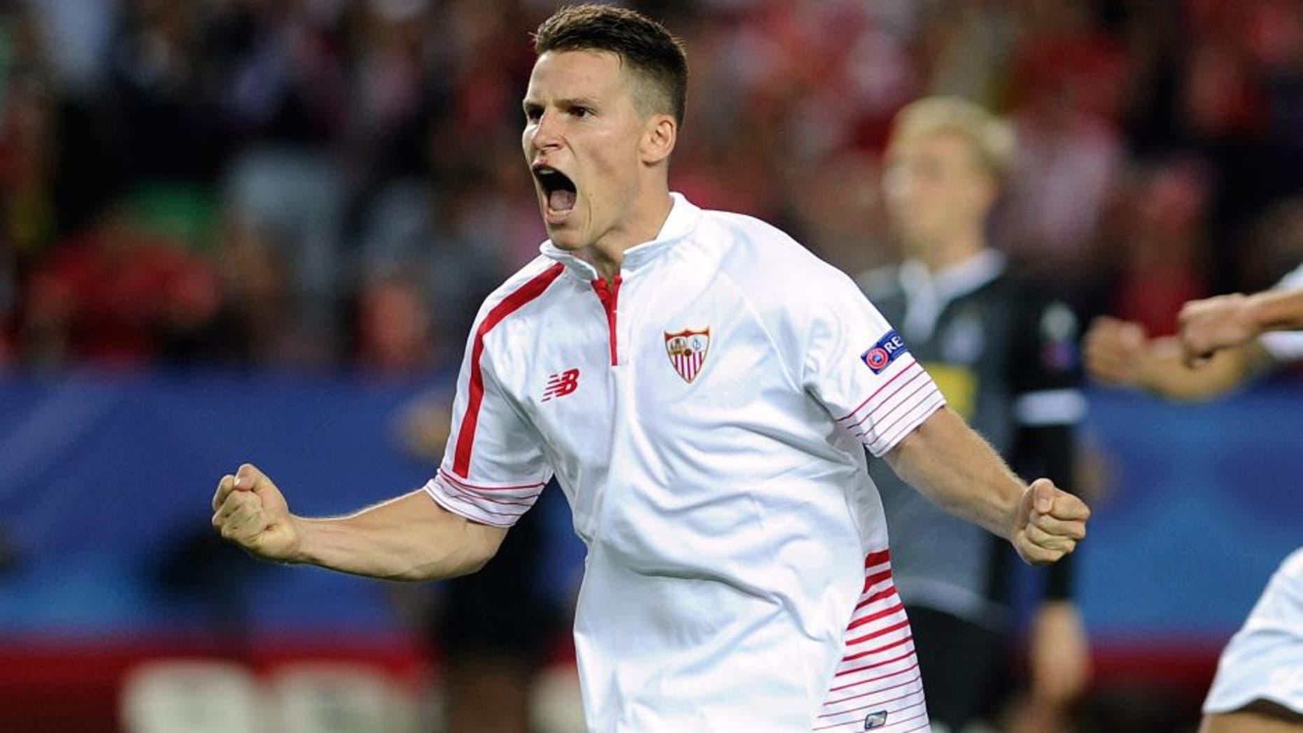 Sevilla's French forward Kevin Gameiro celebrates a goal during the UEFA Champions League group D football match Sevilla FC vs VfL Borussia Moenchengladbach at the Ramon Sanchez Pizjuan stadium in Sevilla on September 15, 2015. AFP PHOTO/ CRISTINA QUICLER (Photo credit should read CRISTINA QUICLER/AFP/Getty Images)