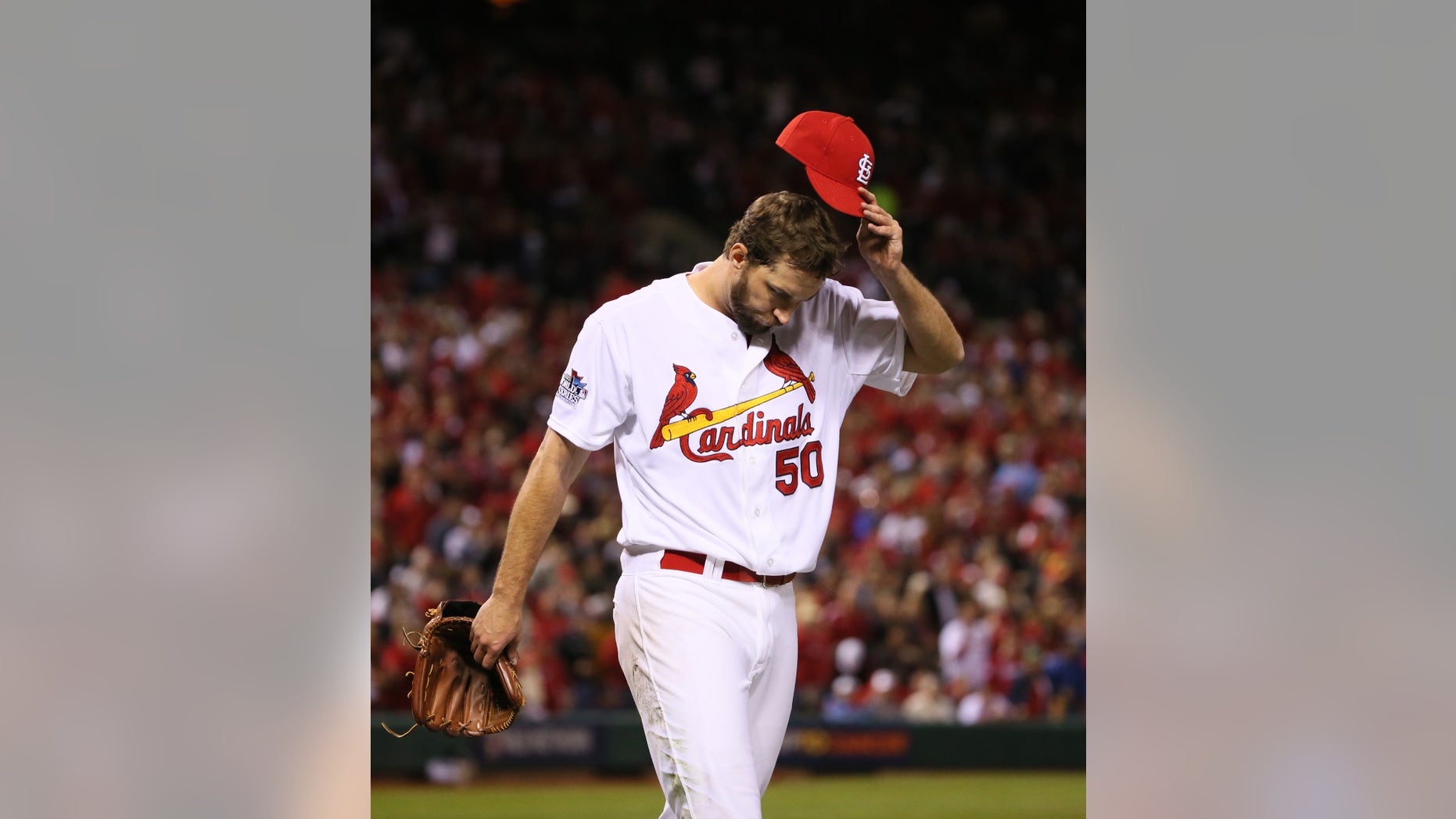 St. Louis Cardinals starting pitcher Adam Wainwright returns to the dugout after allowing two runs in the seventh inning during Game 5 of the World Series between the St. Louis Cardinals and the Boston Red Sox on Monday, Oct. 28, 2013, at Busch Stadium in St. Louis. (AP Photo/St. Louis Post-Dispatch, Chris Lee)