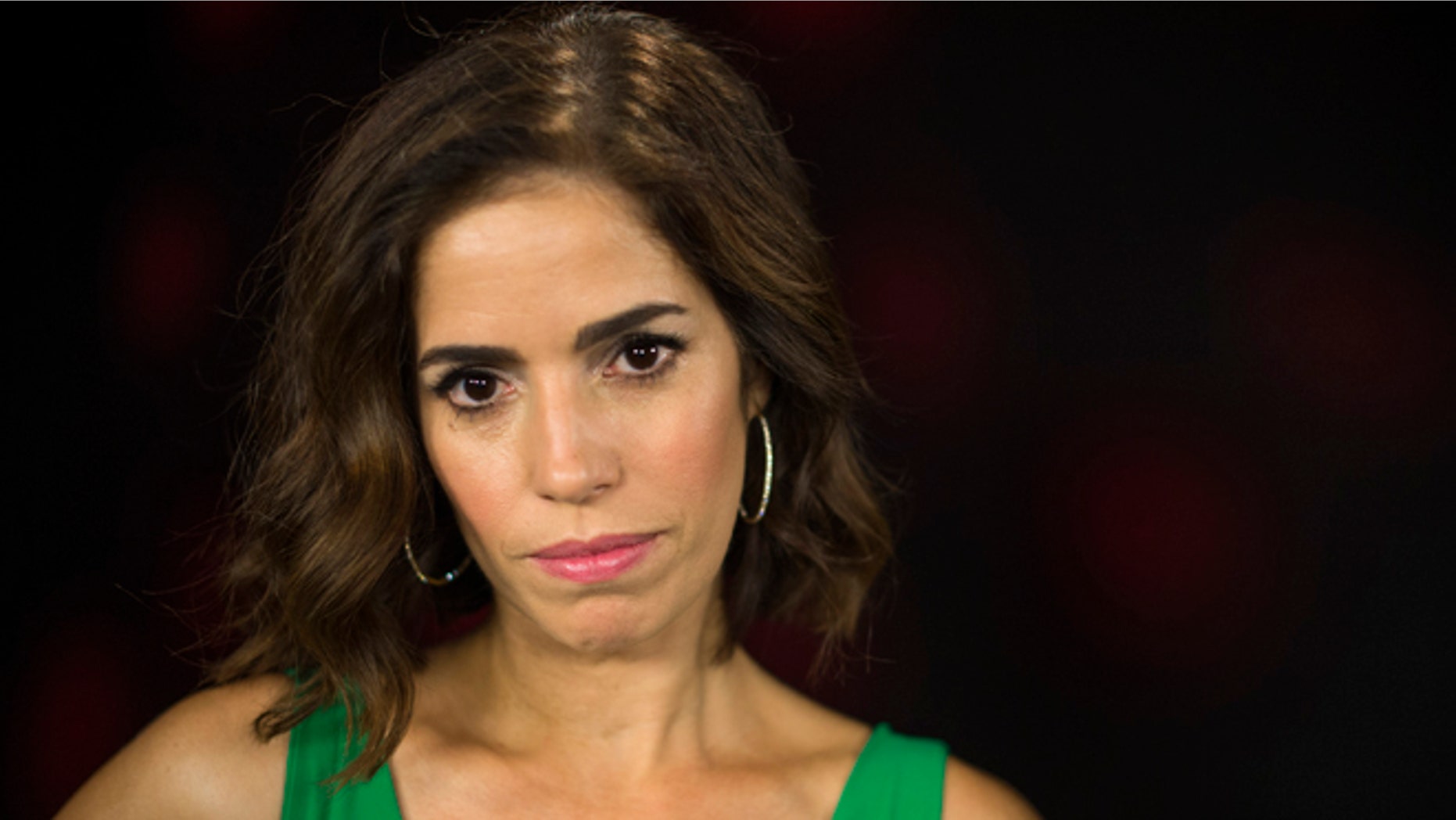 In this Friday, June 20, 2014 photo, Ana Ortiz poses for a portrait in Los Angeles. Ortiz is the star of the Lifetime TV series "Devious Maids," the season finale of which airs Sunday night, July 13, 2014. (Photo by Jordan Strauss/Invision/AP)