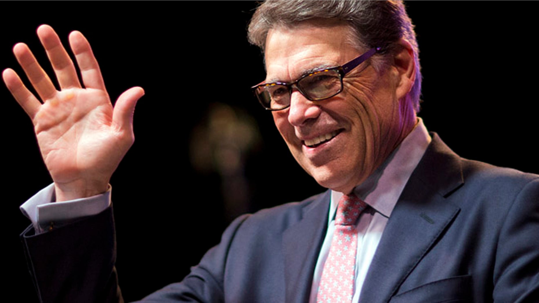 Aug. 7, 2015: Republican presidential candidate, former Texas Gov. Rick Perry, waves to the crowd as he steps to the podium to speak at the RedState Gathering in Atlanta.