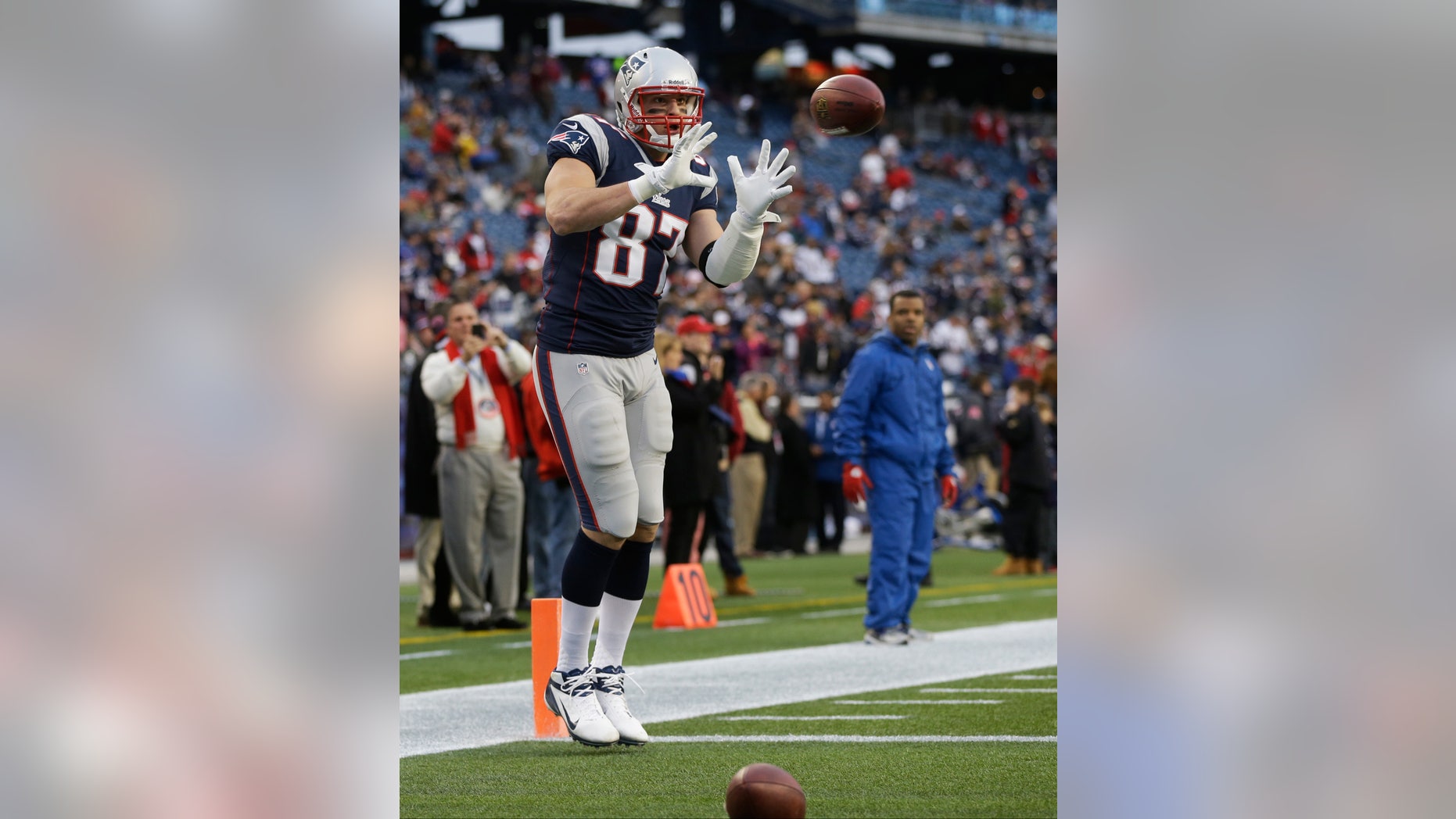 New England Patriots tight end Rob Gronkowski warms up before an AFC divisional playoff NFL football game against the Houston Texans in Foxborough, Mass., Sunday, Jan. 13, 2013. Gronkowski went to the locker room with an arm injury midway through the first quarter, and did not return. (AP Photo/Elise Amendola)