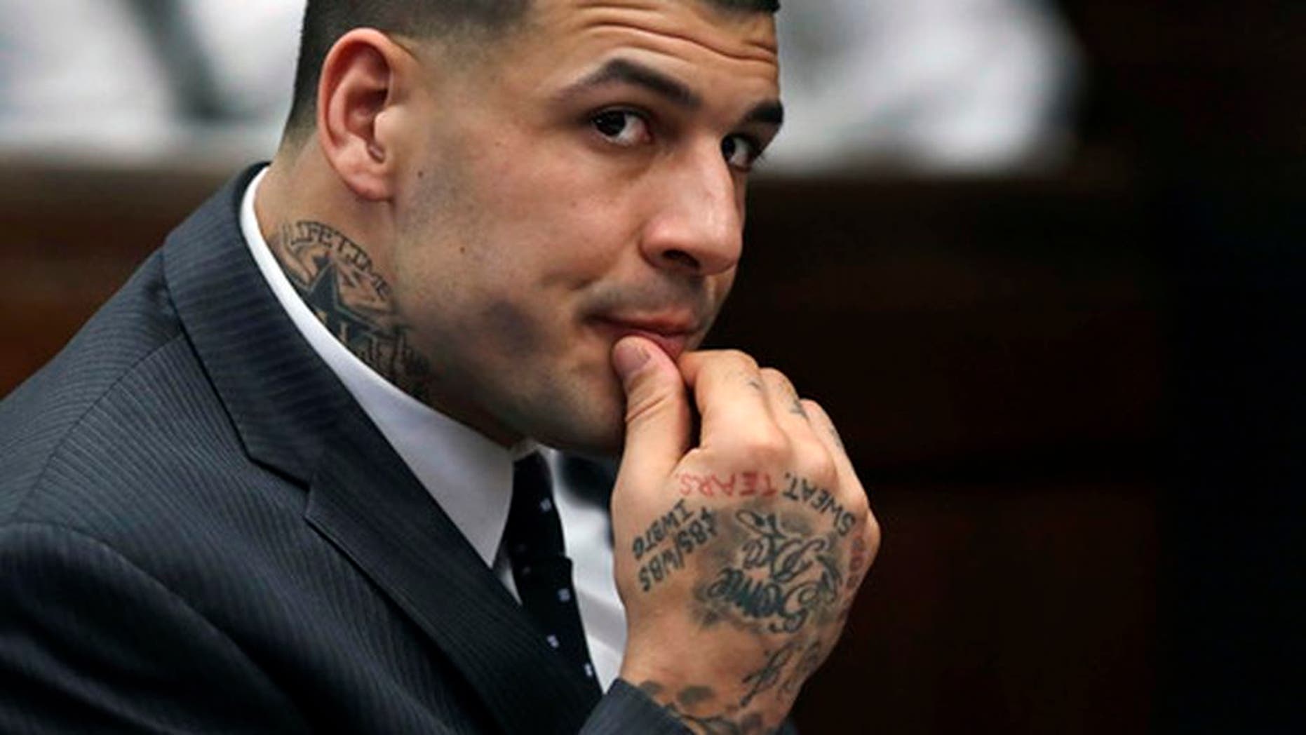 FILE - In this Jan. 19, 2017, file photo, former New England Patriots NFL football player Aaron Hernandez listens during a pretrial hearing at Suffolk Superior Court in Boston. Jury selection for his trial is scheduled to begin on Feb. 13, 2017. He is charged with the July 2012 killings of Daniel de Abreu and Safiro Furtado who he encountered in a Boston nightclub. Hernandez already is serving a life sentence in the 2013 killing of semi-professional football player Odin Lloyd. (AP Photo/Charles Krupa, Pool, File)