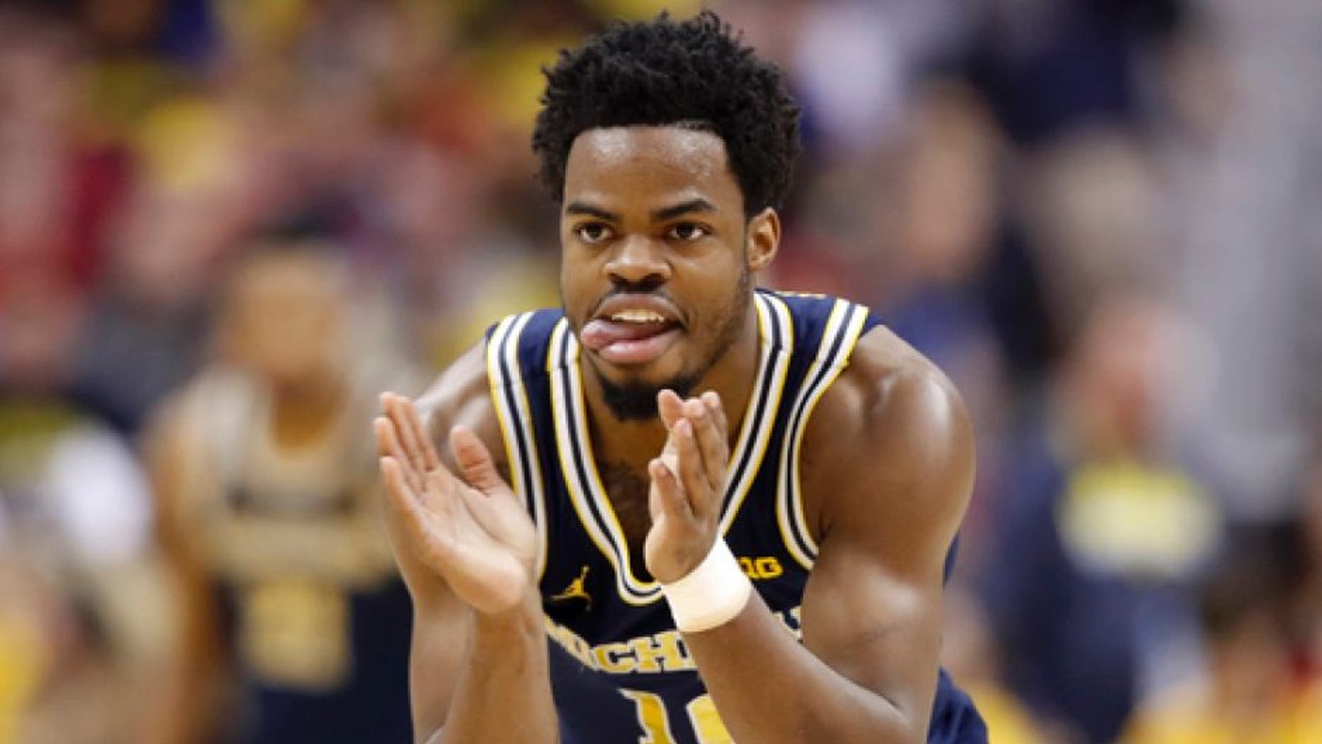 FILE - In this Sunday, March 12, 2017, file photo, Michigan guard Derrick Walton Jr. (10) reacts during the first half of the Big Ten NCAA college basketball championship game against Wisconsin in Washington. Walton has fueled Michigan's turnaround since early February and will now try to lead the Wolverines on an extended run in the NCAA Tournament. (AP Photo/Alex Brandon, File)