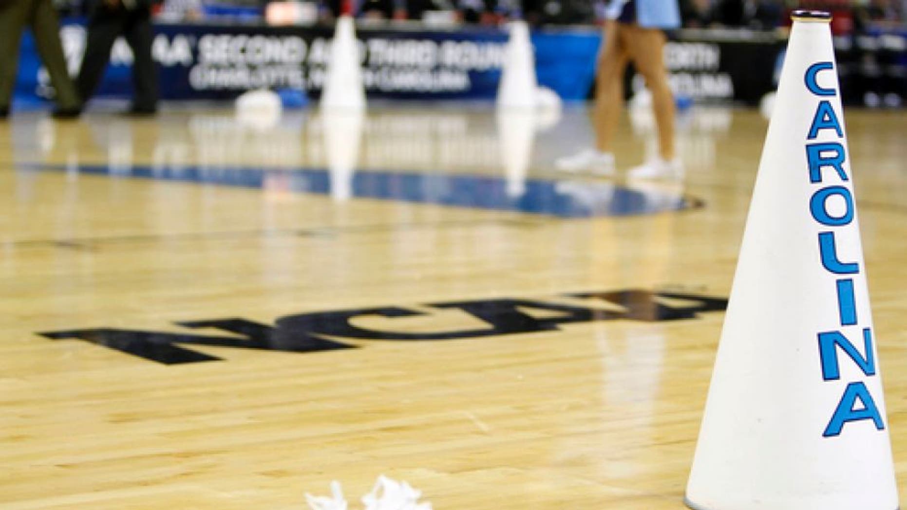FILE - In this March 20, 2011, file photo, North Carolina cheerleaders perform in the second half of a East Regional NCAA tournament third round college basketball game against Washington, in Charlotte, N.C. For years, March brought the NCAA Tournament to basketball-crazed North Carolina like a fixture of spring. And South Carolina watched from afar, left out due to state-level politics that drew the ire of the NCAA. Those neighboring states are suddenly in reversed roles this weekend, with North Carolina _ host to more tournament games than any other state _ on the outside as South Carolina hosts its first NCAA games in 15 years. (AP Photo/Chuck Burton, File)
