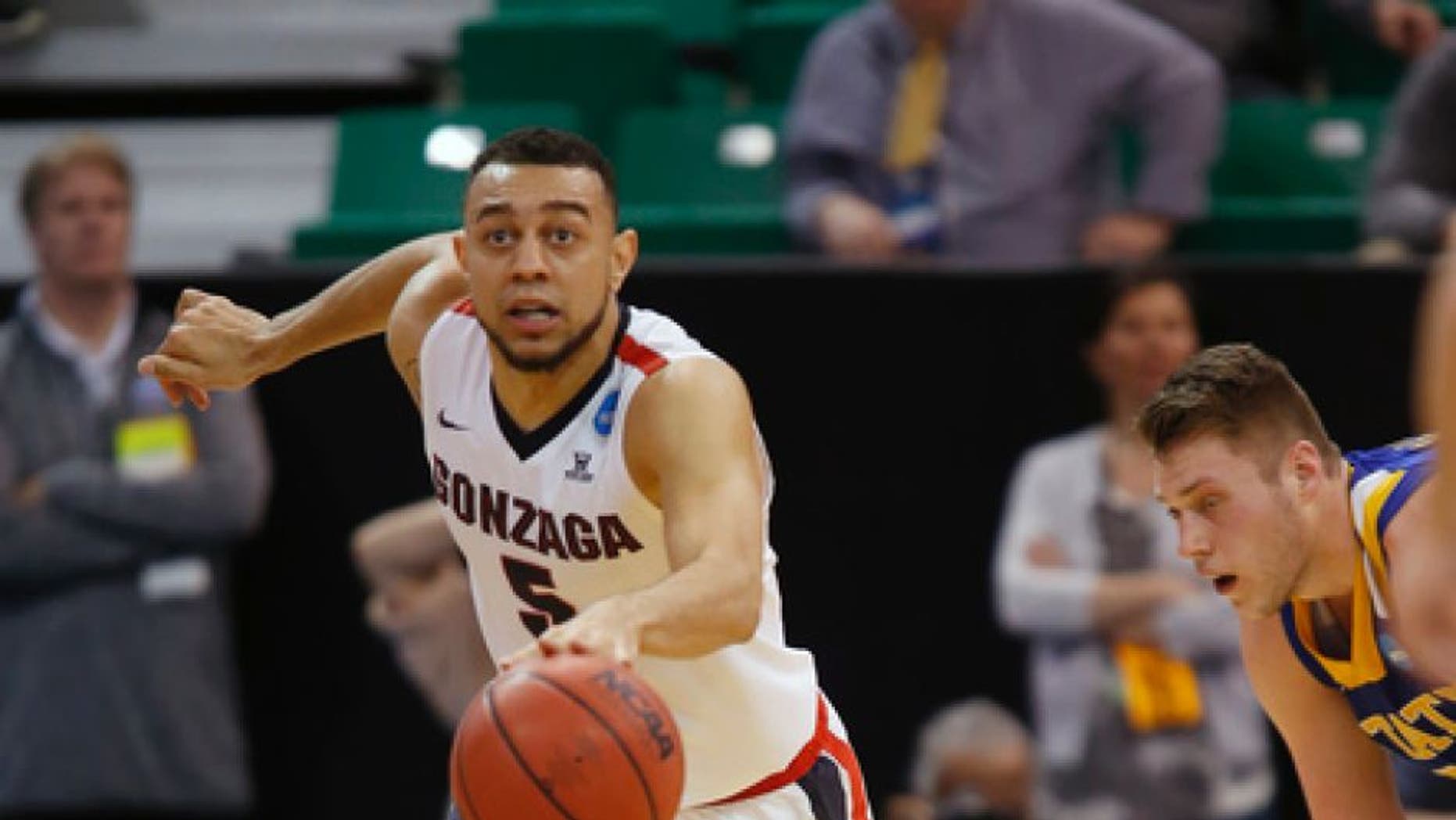 Gonzaga guard Nigel Williams-Goss (5) moves the ball down court after stealing it from South Dakota State forward Mike Daum, right, during the first half of a first-round men's college basketball in the NCAA Tournament, Thursday, March 16, 2017, in Salt Lake City. (AP Photo/George Frey)