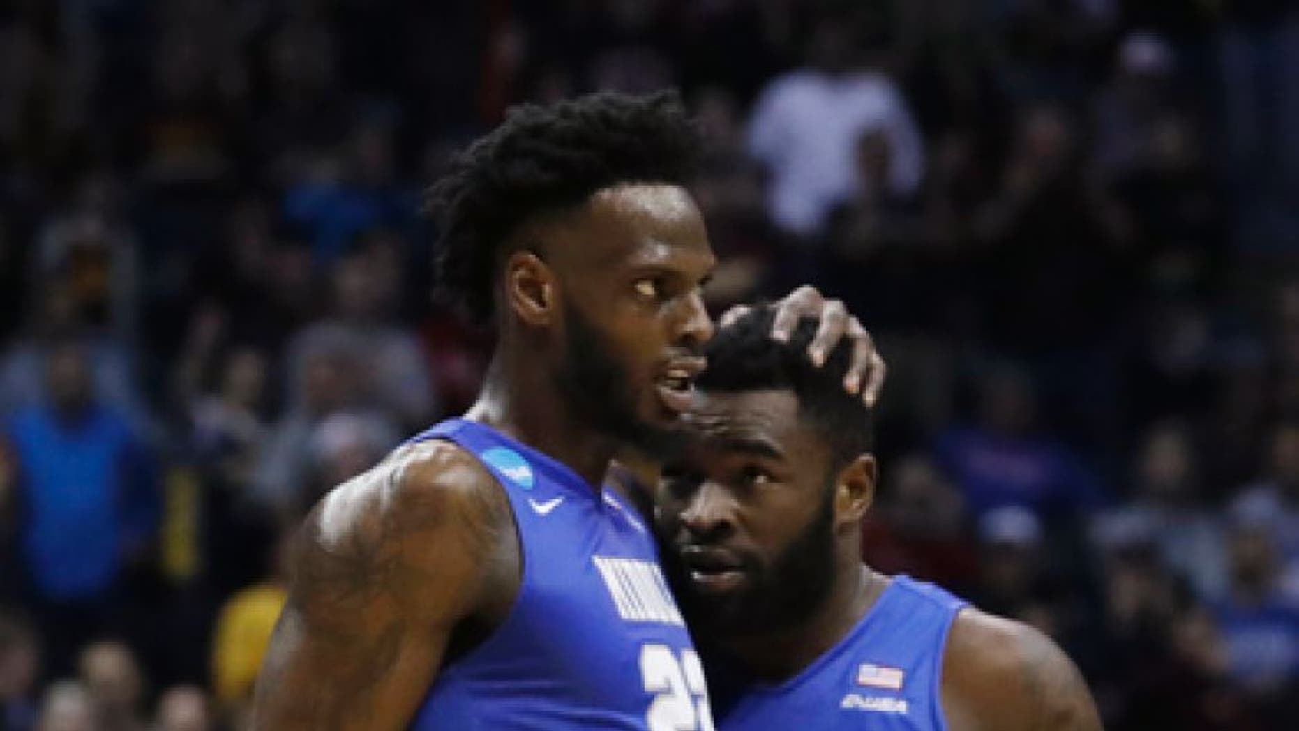 Middle Tennessee State's JaCorey Williams (22) and Giddy Potts (20) celebrate during the second half of an NCAA college basketball tournament first round game against Minnesota Thursday, March 16, 2017, in Milwaukee. Middle Tennessee State won 81-72. (AP Photo/Morry Gash)