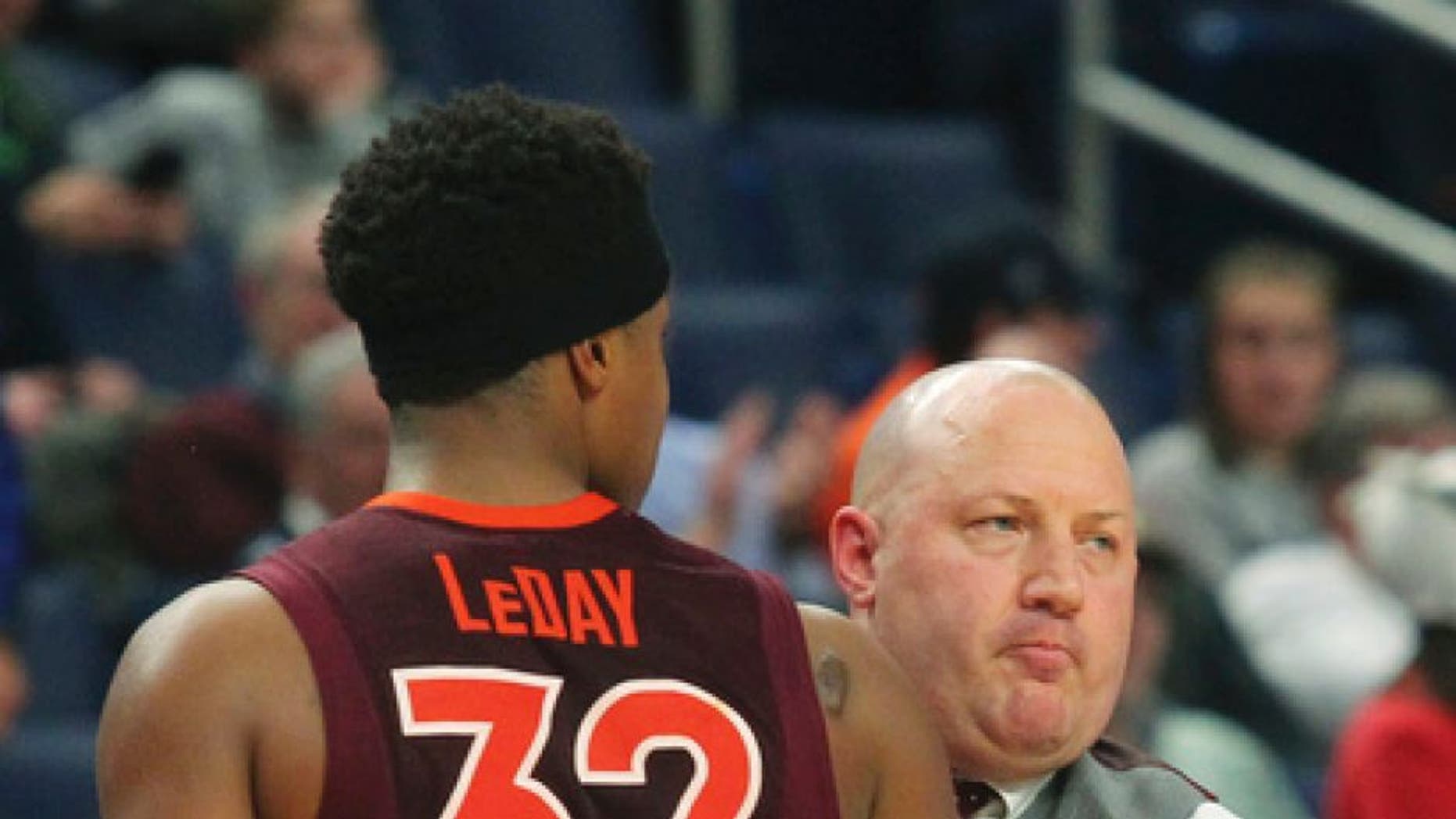 Virginia Tech forward Zach LeDay (32) hugs head coach Buzz Williams after fouling out during the second half of a first-round men's college basketball game in the NCAA Tournament, Thursday, March 16, 2017, in Buffalo, N.Y. Wisconsin won, 84-74. (AP Photo/Bill Wippert)