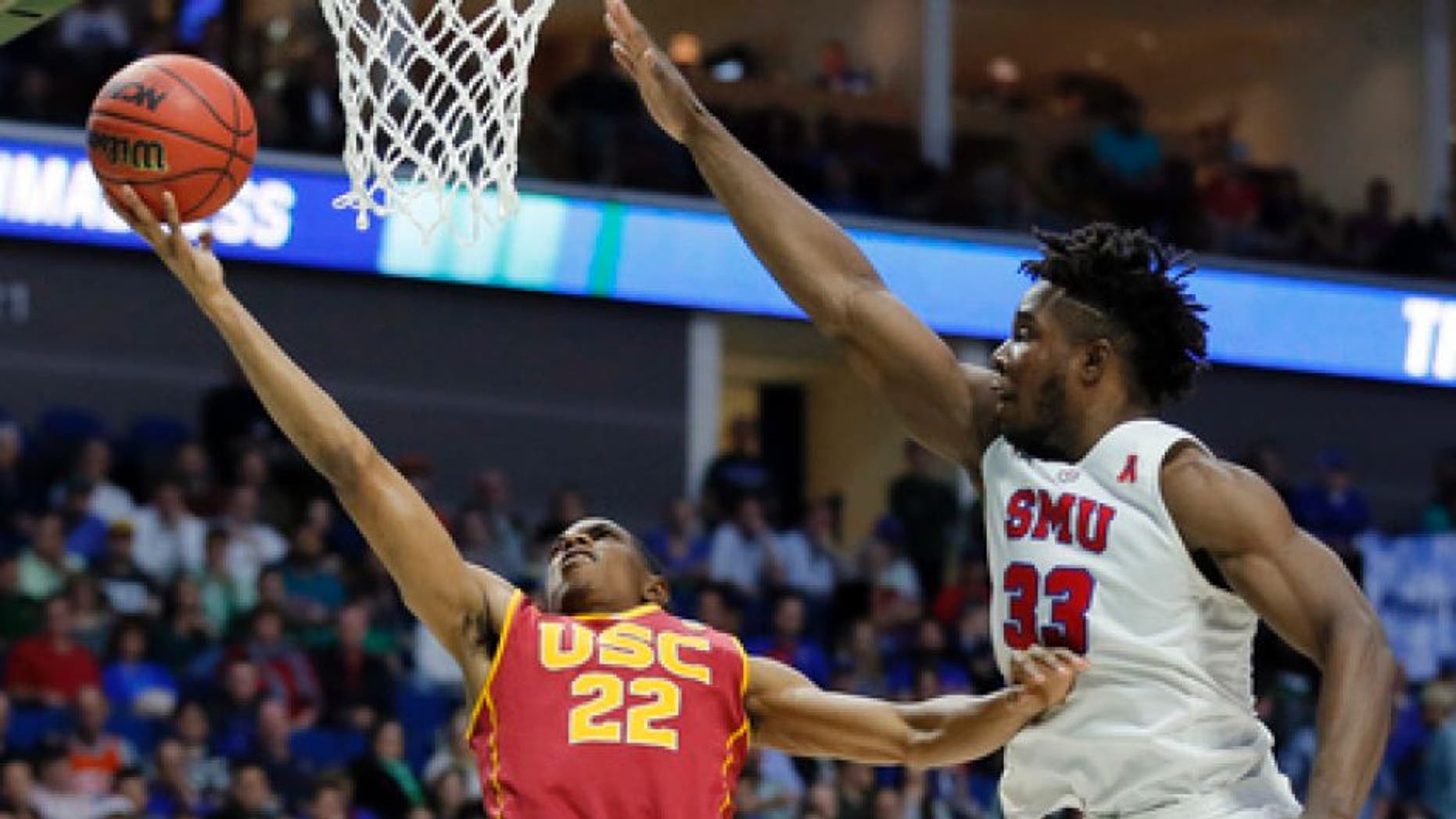 Southern California's De'Anthony Melton (22) goes up for a shot as SMU's Semi Ojeleye (33) defends in the second half of a first-round game in the men's NCAA college basketball tournament in Tulsa, Okla., Friday March 17, 2017. (AP Photo/Tony Gutierrez)