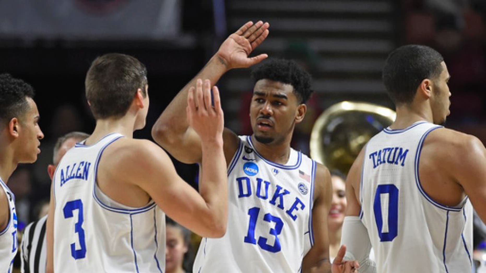 Duke's Matt Jones (13) celebrates with Grayson Allen (3) during the first half against Troy in a first-round game of the NCAA men's college basketball tournament in Greenville, S.C., Friday, March 17, 2017. (AP Photo/Rainier Ehrhardt)