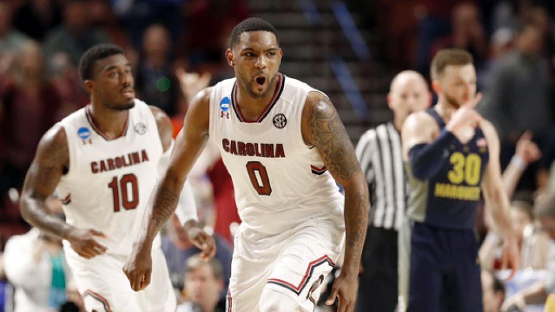 South Carolina's Sindarius Thornwell (0) reacts to making a basket against Marquette during the second half in a first-round game of the NCAA men's college basketball tournament in Greenville, S.C., Friday, March 17, 2017. (AP Photo/Chuck Burton)