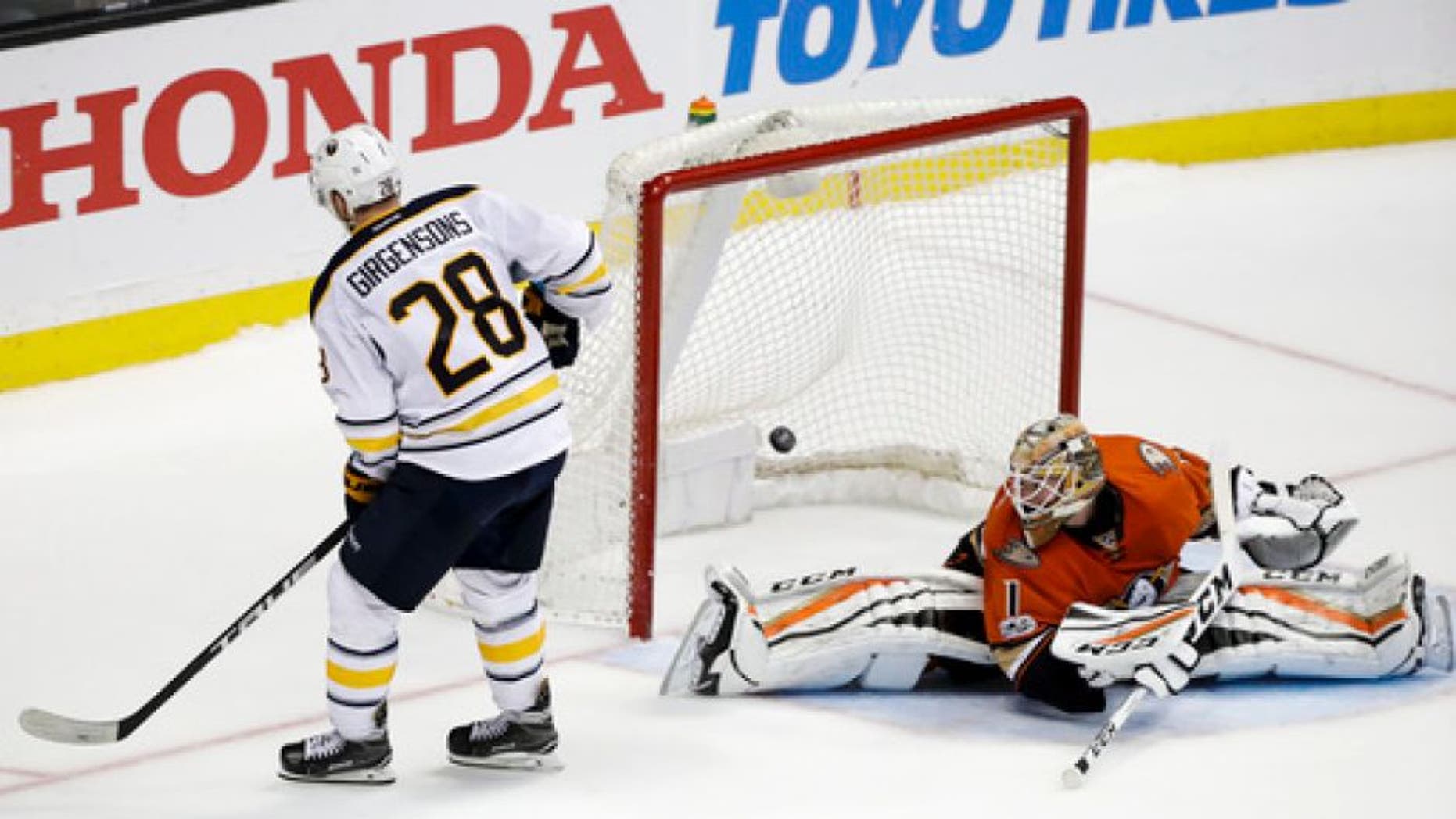 Buffalo Sabres' Zemgus Girgensons, left, of Latvia, scores against Anaheim Ducks goalie Jonathan Bernier during the shootout of an NHL hockey game Friday, March 17, 2017, in Anaheim, Calif. The Sabres won 2-1. (AP Photo/Jae C. Hong)