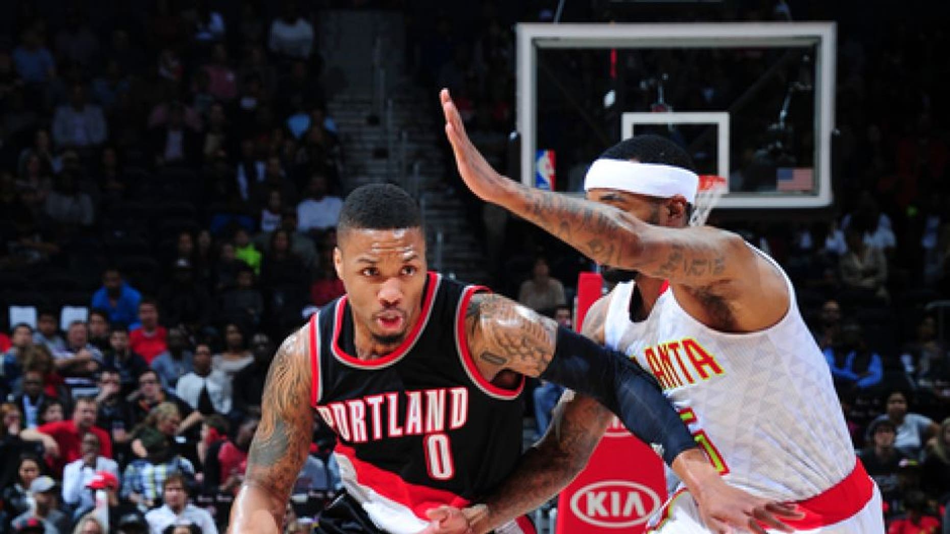 ATLANTA, GA - MARCH 18: Damian Lillard #0 of the Portland Trail Blazers drives to the basket against the Atlanta Hawks during the game on March 18, 2017 at Philips Arena in Atlanta, Georgia. NOTE TO USER: User expressly acknowledges and agrees that, by downloading and/or using this Photograph, user is consenting to the terms and conditions of the Getty Images License Agreement. Mandatory Copyright Notice: Copyright 2017 NBAE (Photo by Scott Cunningham/NBAE via Getty Images)