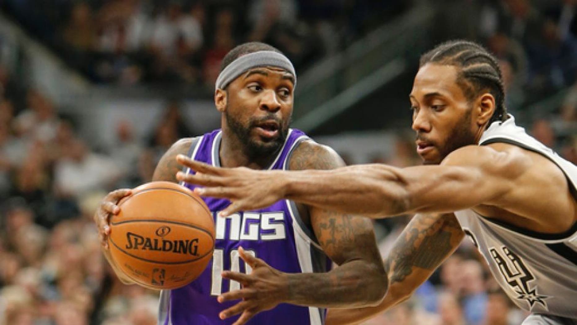 SAN ANTONIO,TX - MARCH 19: Ty Lawson #10 of the Sacramento Kings drives on Kawhi Leonard #2 of the San Antonio Spurs at AT&T Center on March 19, 2017 in San Antonio, Texas. NOTE TO USER: User expressly acknowledges and agrees that , by downloading and or using this photograph, User is consenting to the terms and conditions of the Getty Images License Agreement. (Photo by Ronald Cortes/Getty Images)