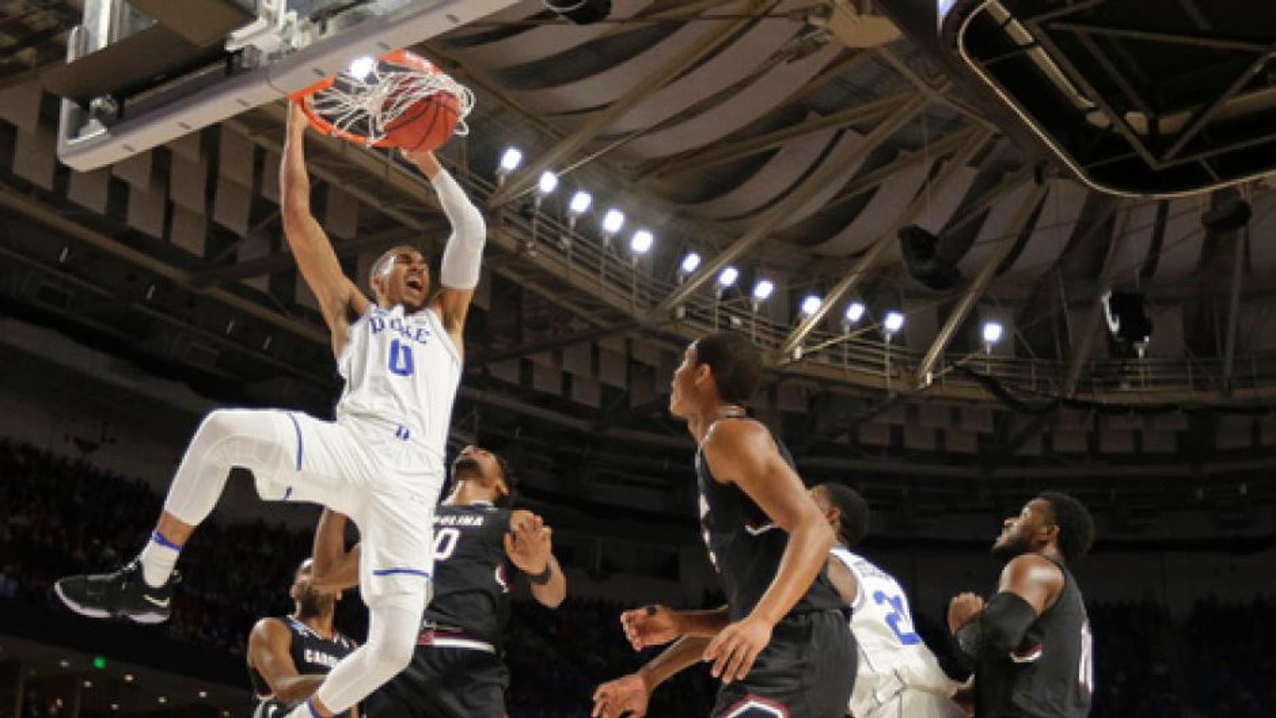 Duke's Jayson Tatum (0) dunks against South Carolina during the first half in a second-round game of the NCAA men's college basketball tournament in Greenville, S.C., Sunday, March 19, 2017. (AP Photo/Rainier Ehrhardt)